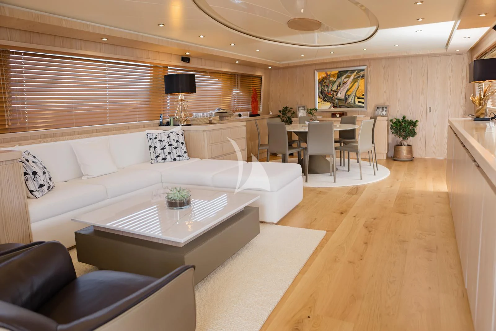 a living room with a couch and a table aboard STAR LINK Yacht for Sale