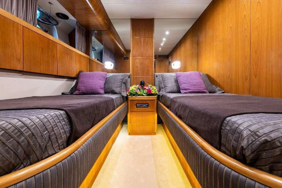 a room with a couple of beds aboard STAR LINK Yacht for Sale