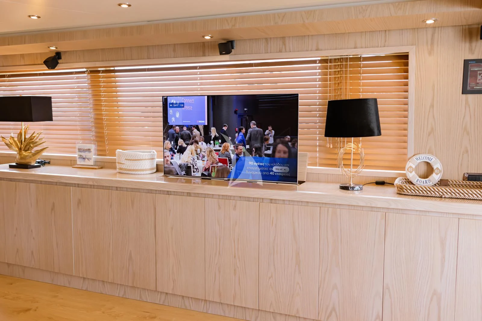 a room with a tv and a desk with a lamp aboard STAR LINK Yacht for Sale