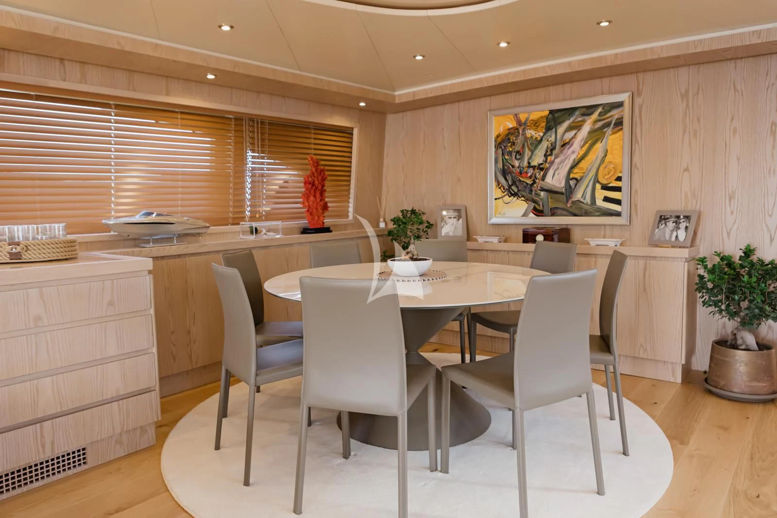 a kitchen with a table and chairs aboard STAR LINK Yacht for Sale