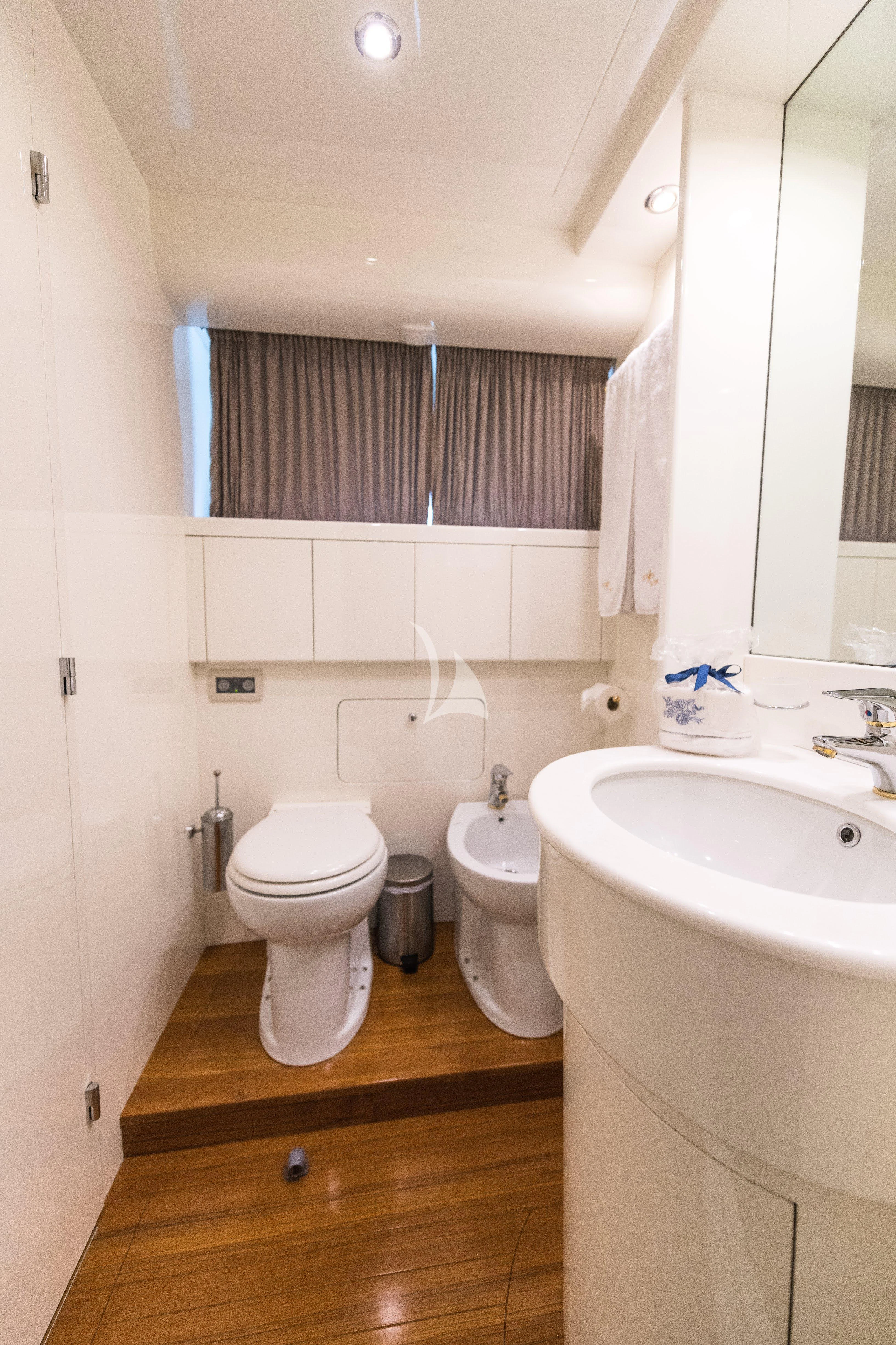 a bathroom with a toilet sink and a bathtub aboard STAR LINK Yacht for Sale
