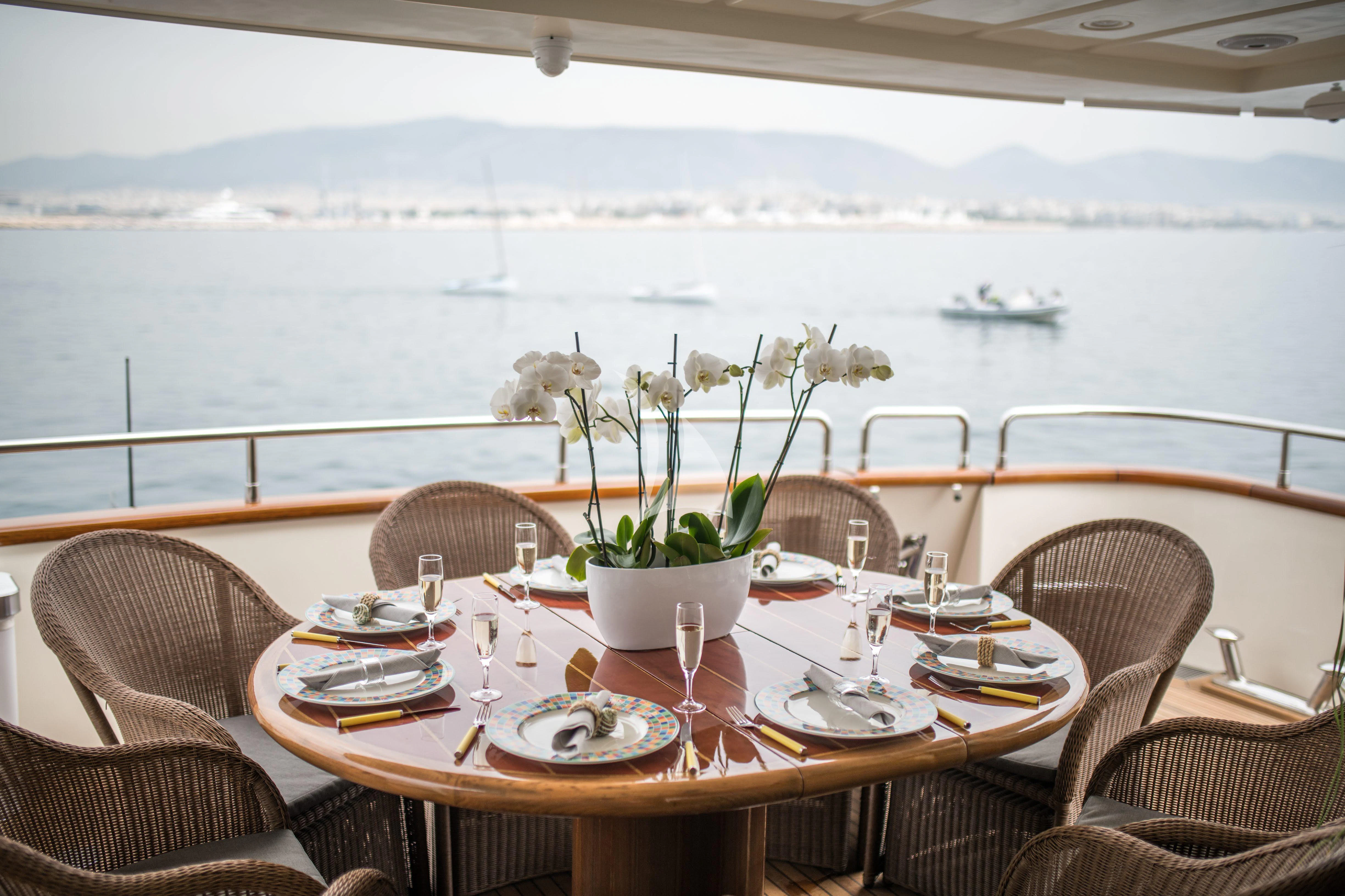 a table set for a dinner aboard STAR LINK Yacht for Sale