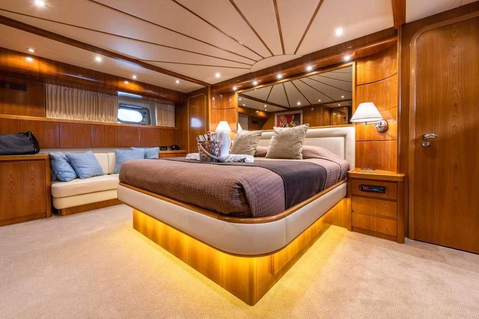 a room with a bed and a couch aboard STAR LINK Yacht for Sale