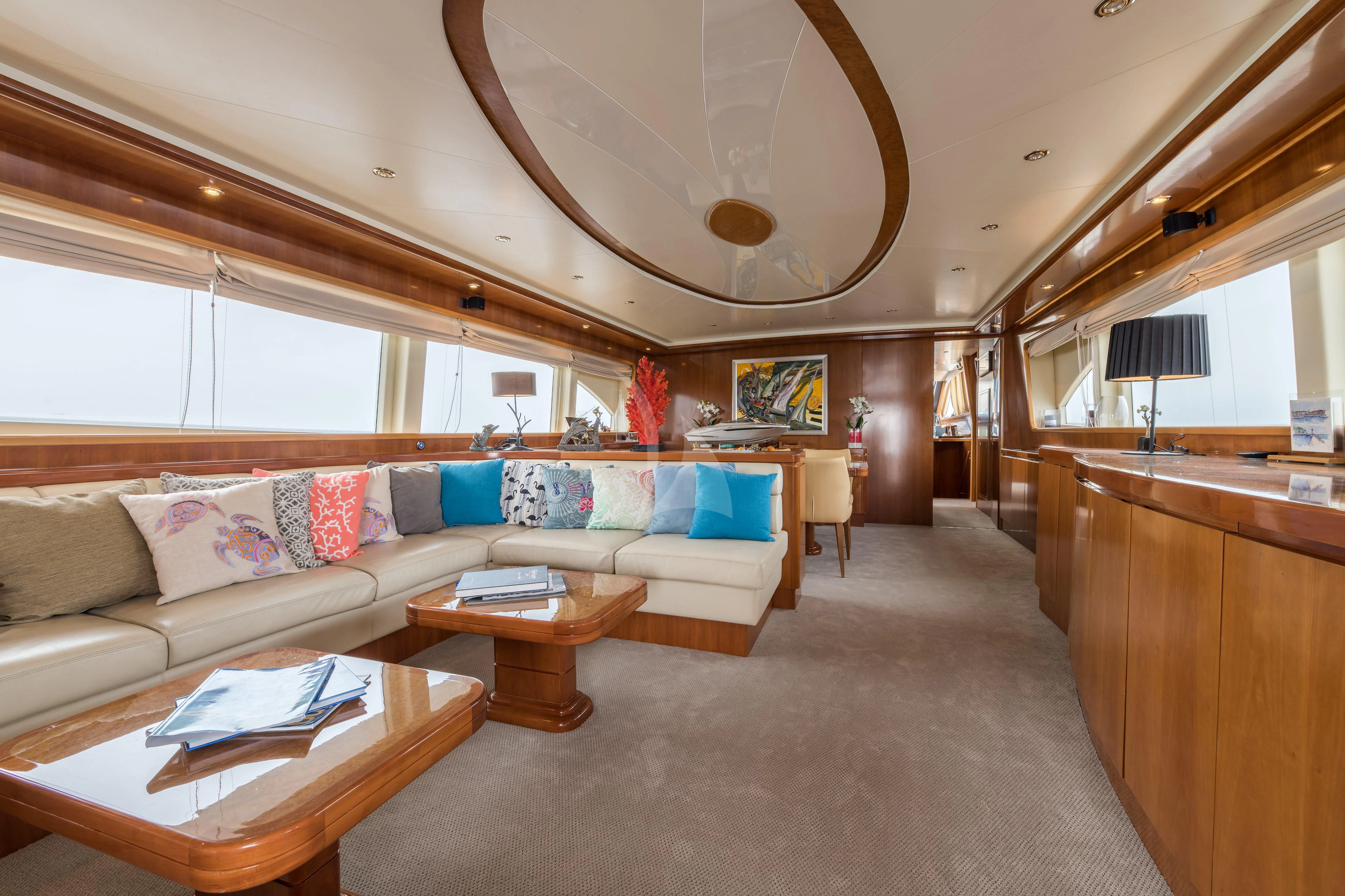 a living room with a large chandelier aboard STAR LINK Yacht for Sale