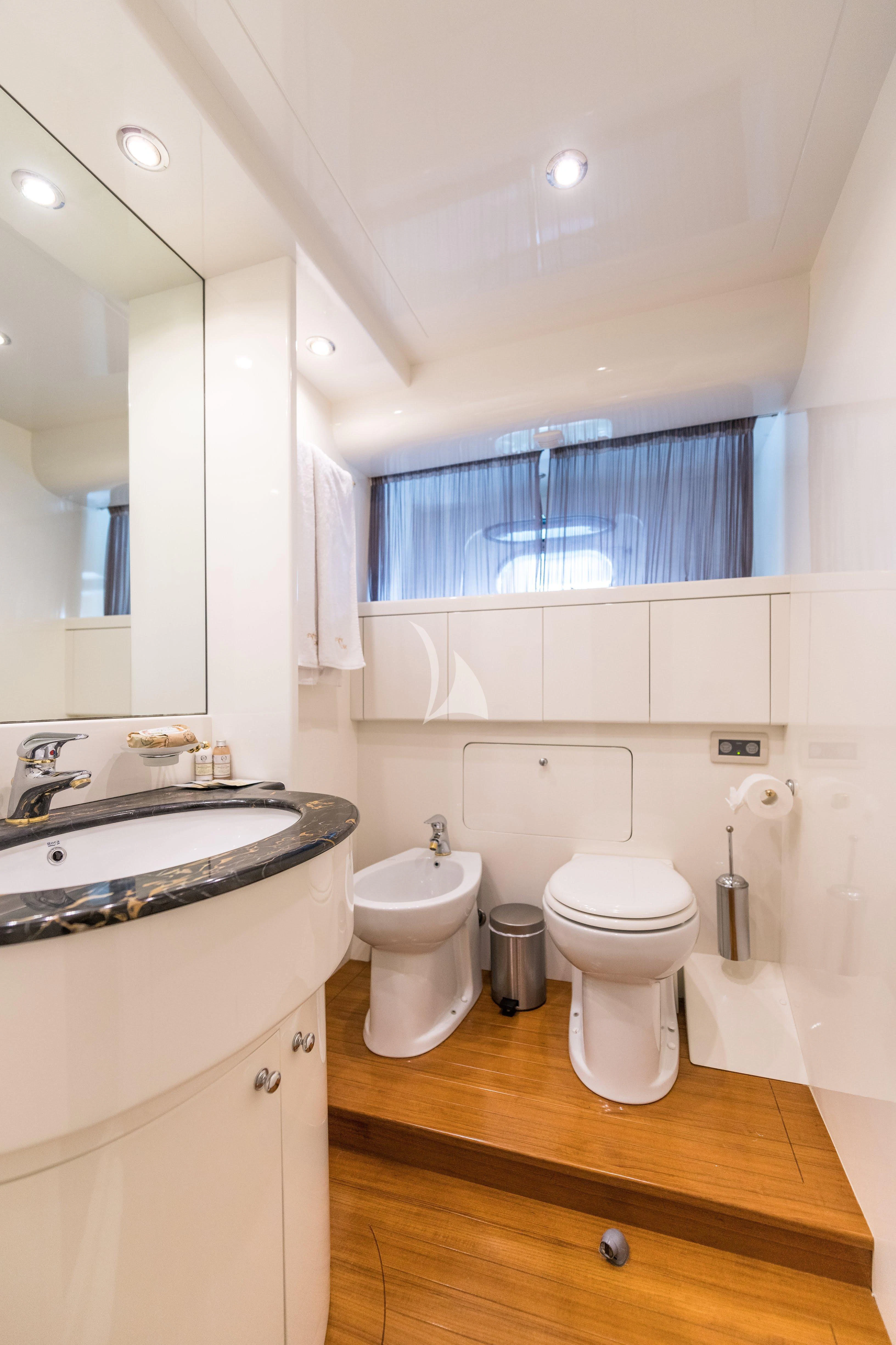 a bathroom with a toilet and sink aboard STAR LINK Yacht for Sale