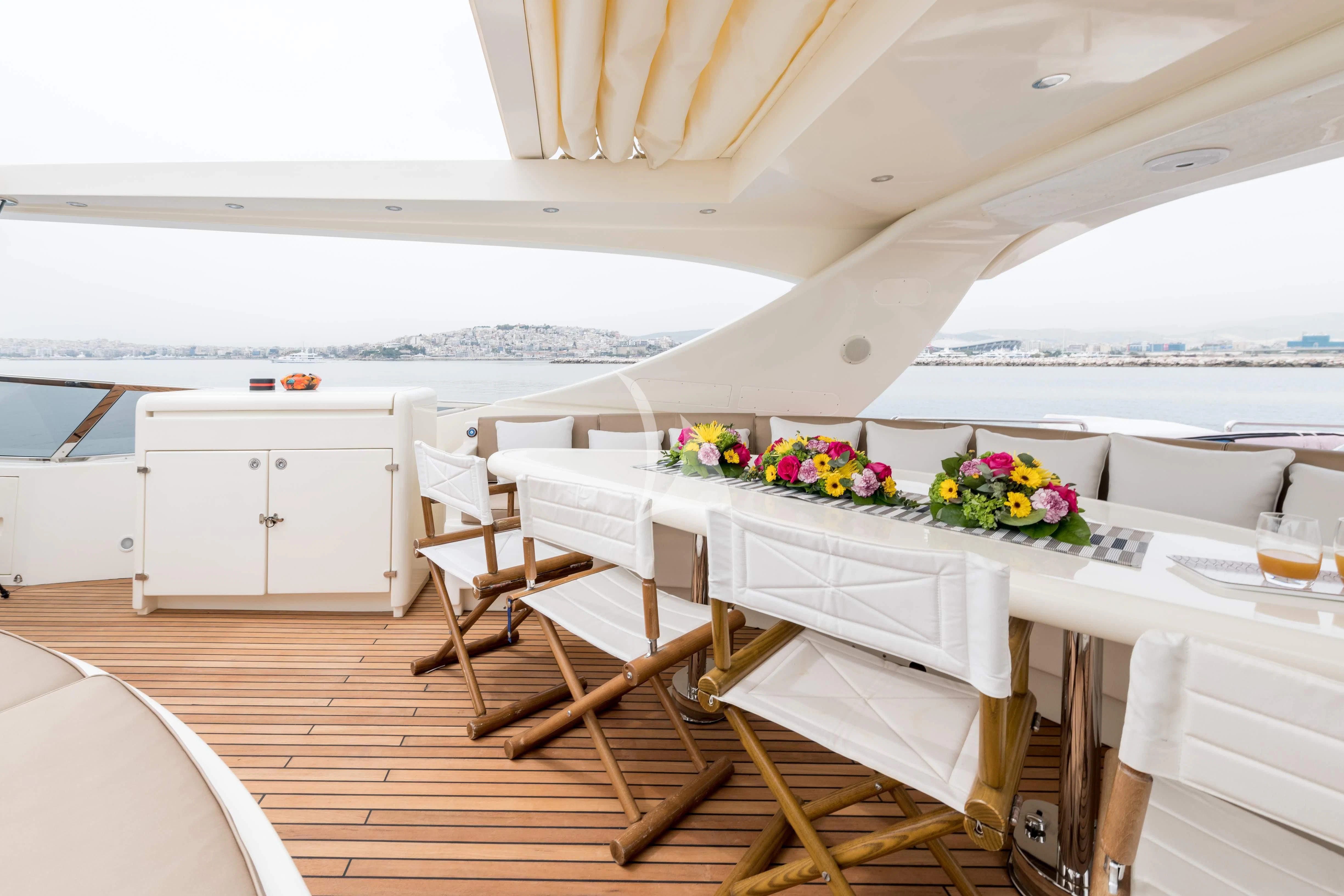 a room with a table and chairs aboard STAR LINK Yacht for Sale