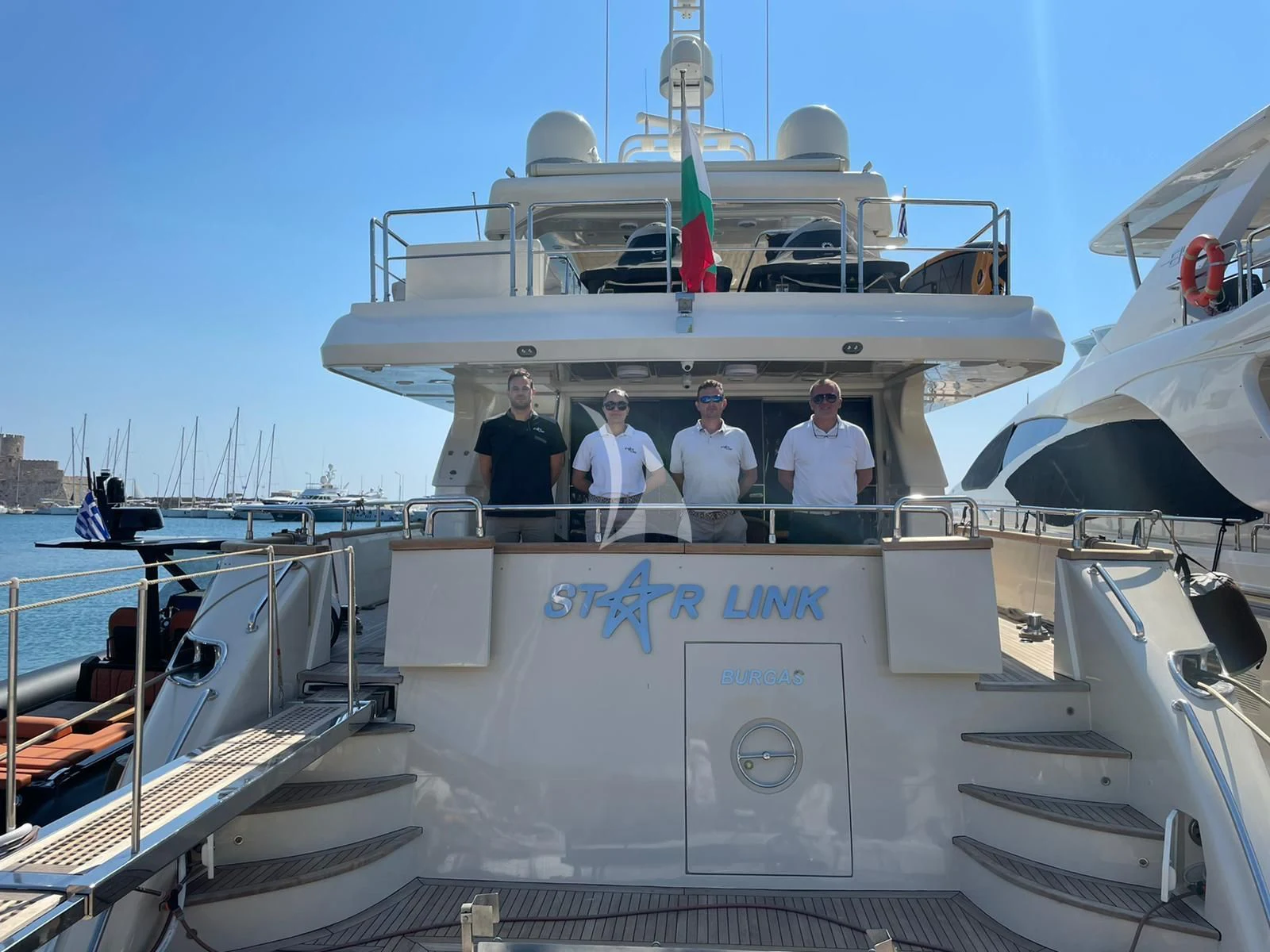 a group of men on a boat aboard STAR LINK Yacht for Sale