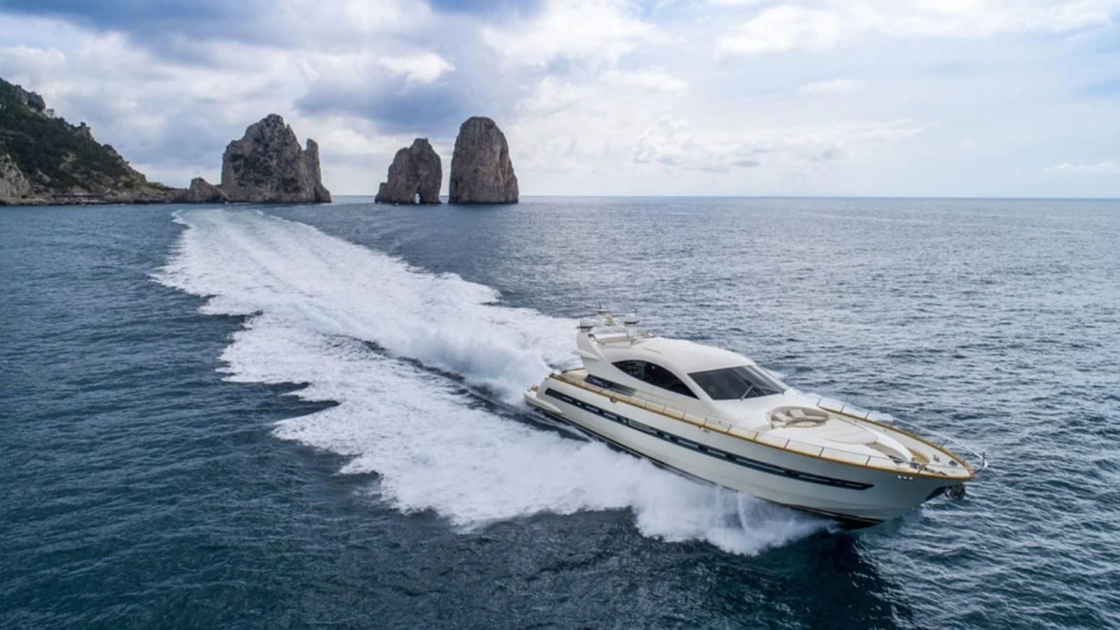 a white car driving on a body of water aboard MIDNIGHT MADNESS Yacht for Sale
