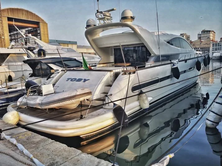 a boat docked at a pier aboard MIDNIGHT MADNESS Yacht for Sale