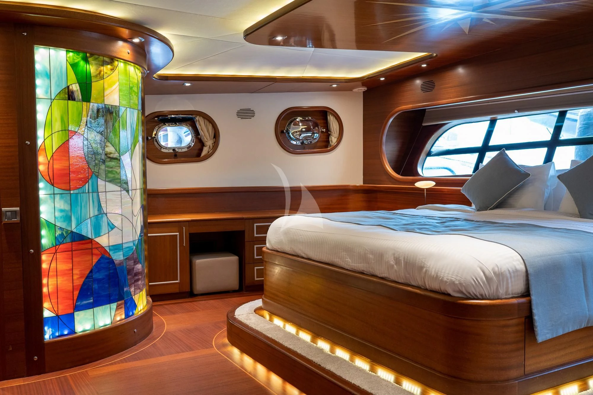 a room with a bed and a television aboard LA BELLA VITA Yacht for Sale