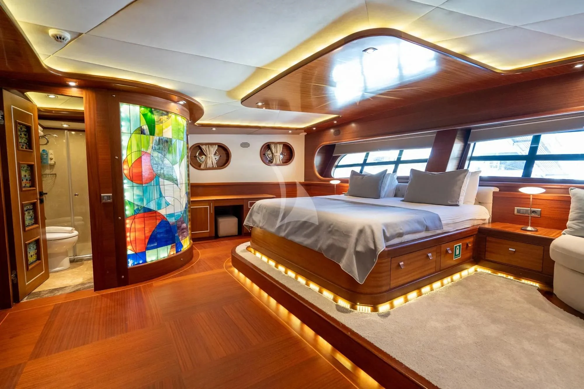 a bedroom with a large bed aboard LA BELLA VITA Yacht for Sale