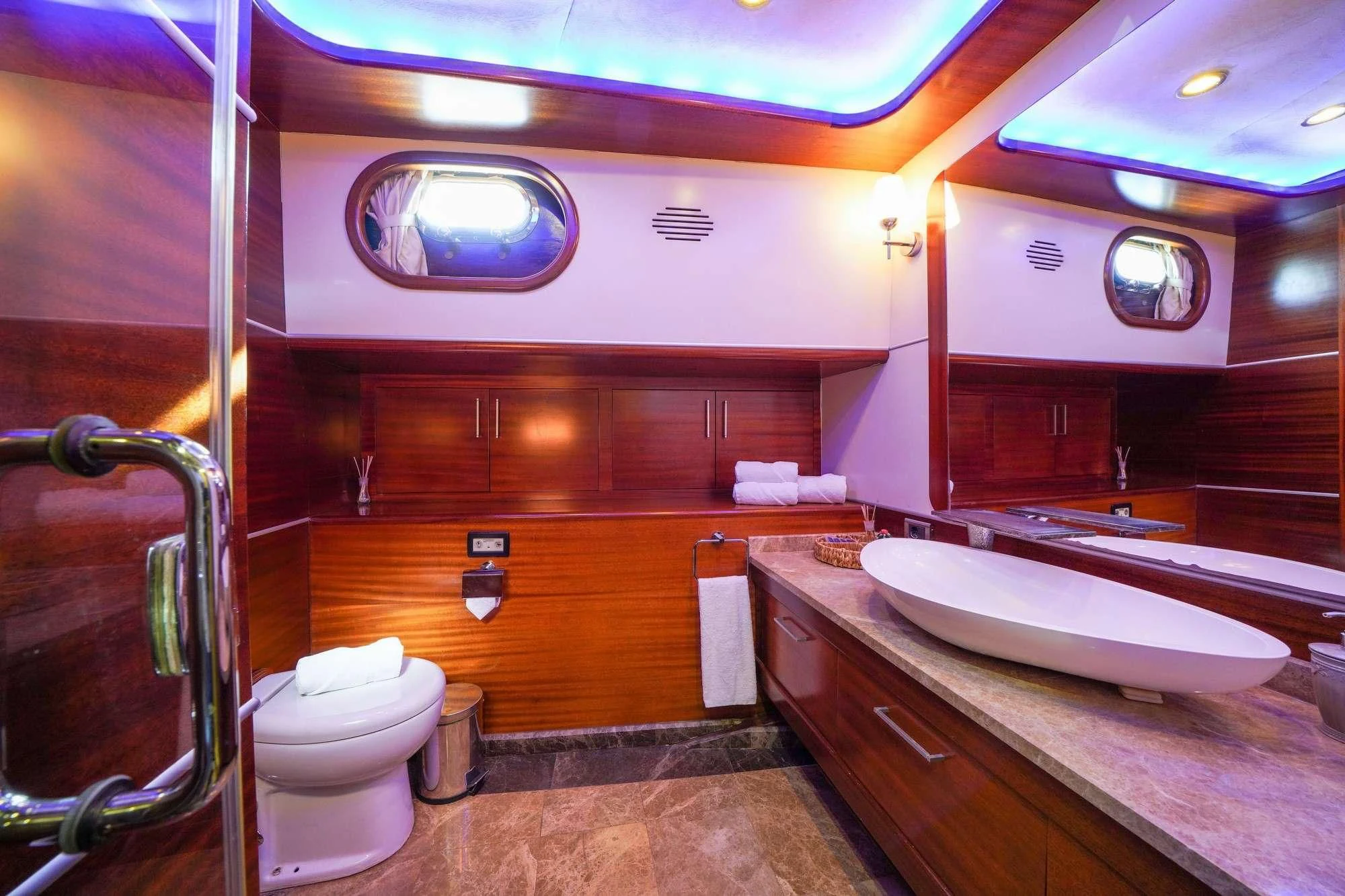 a bathroom with a sink and toilet aboard LA BELLA VITA Yacht for Sale