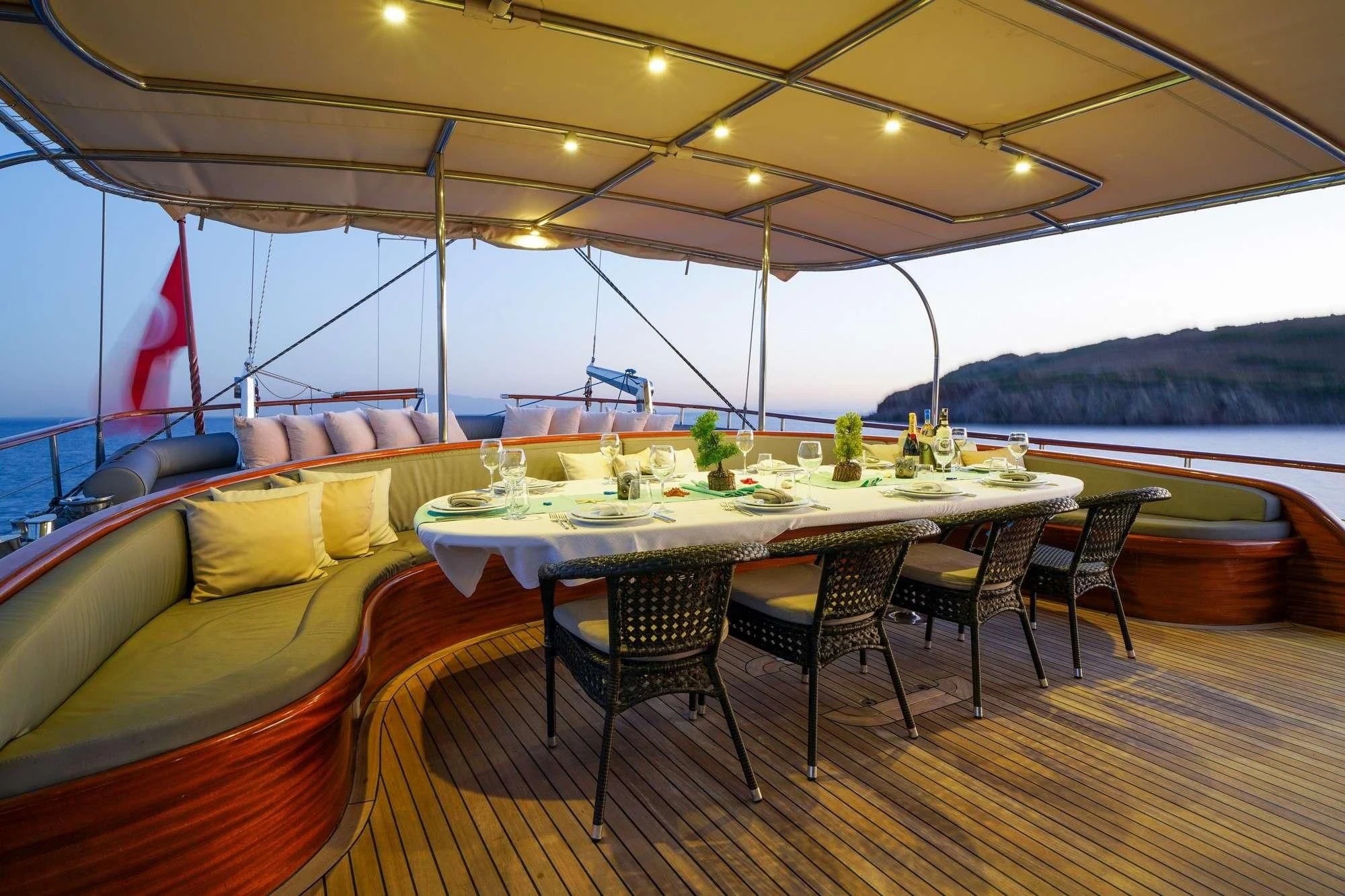 a table and chairs on a boat aboard LA BELLA VITA Yacht for Sale