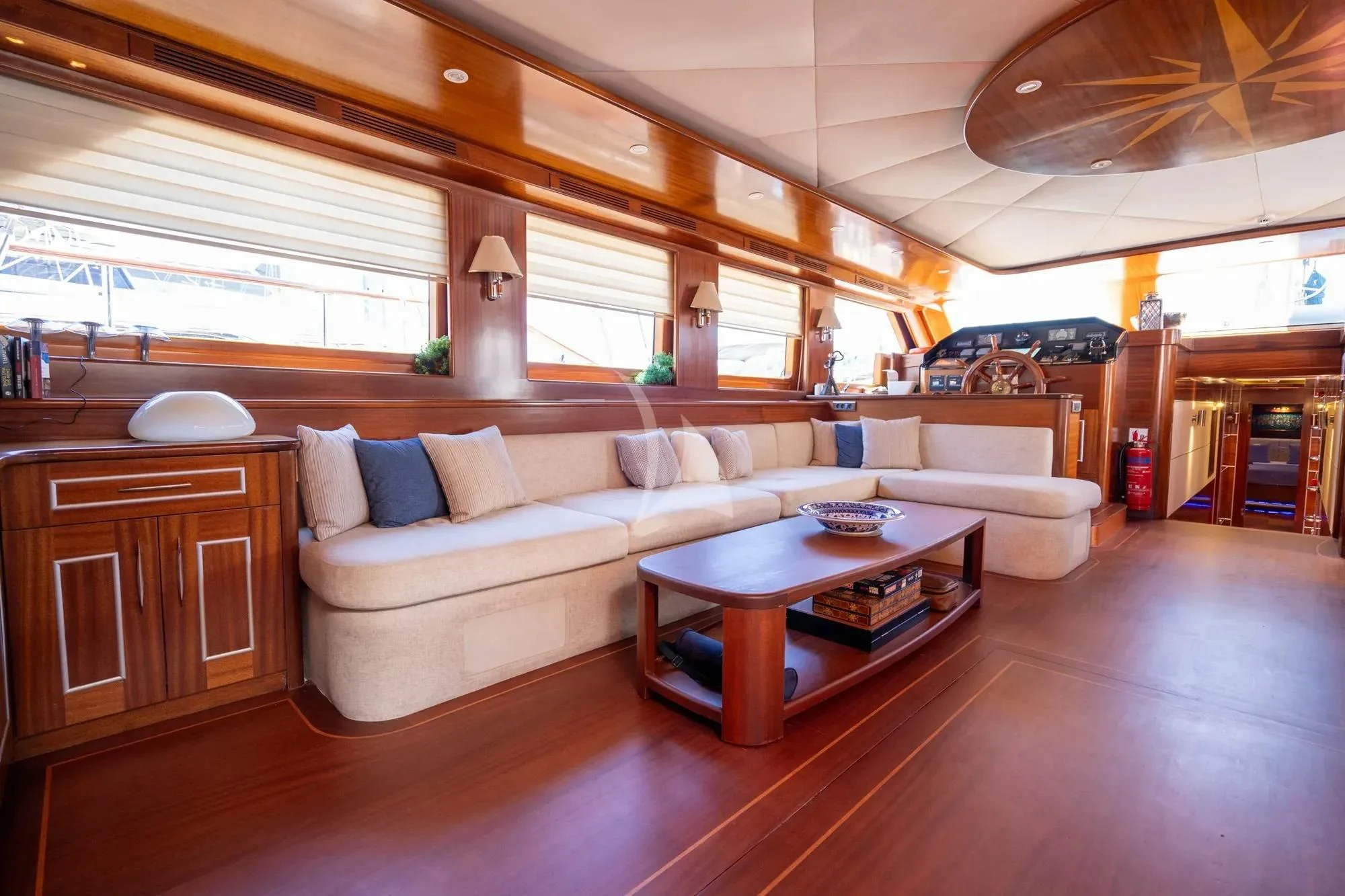 a living room with a couch and a coffee table aboard LA BELLA VITA Yacht for Sale