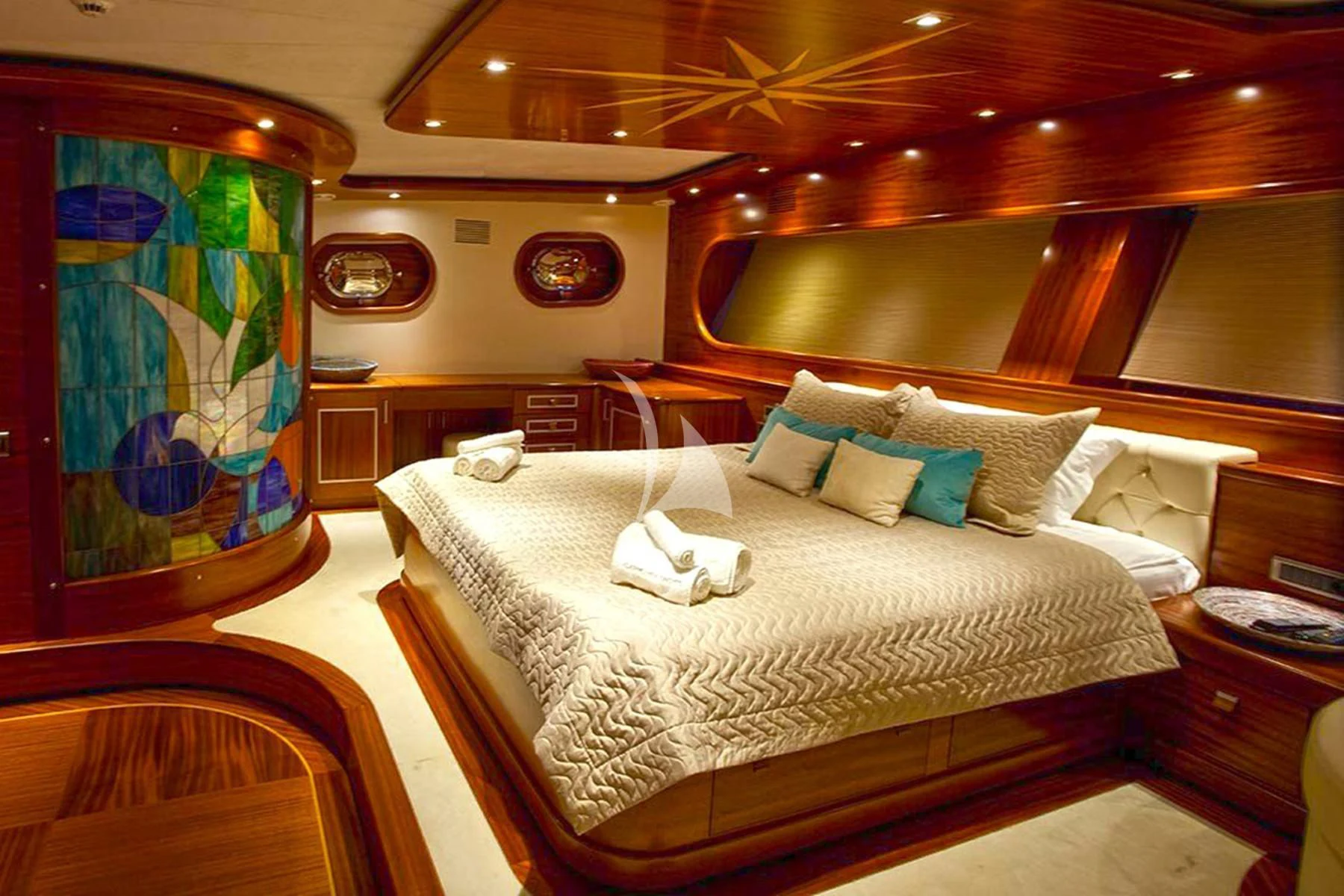 a bed in a room aboard LA BELLA VITA Yacht for Sale