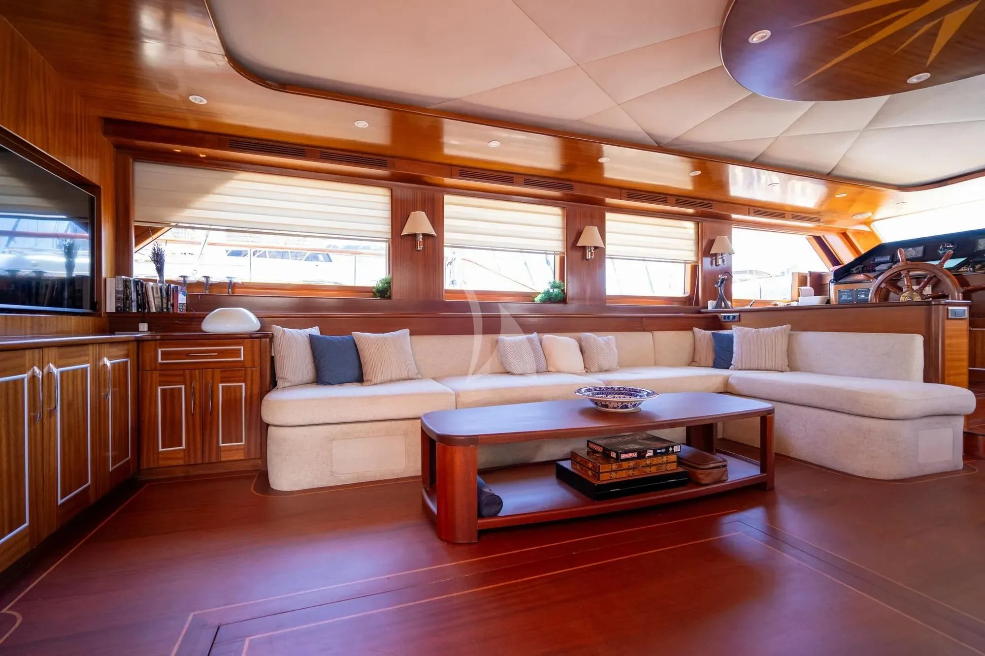 a living room with a wood floor aboard LA BELLA VITA Yacht for Sale