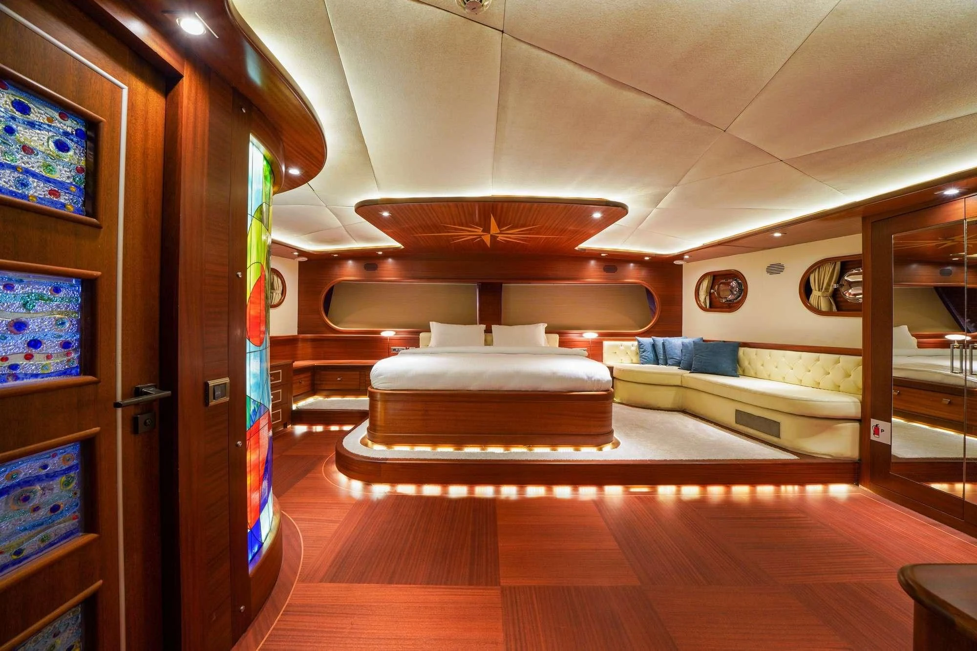 a room with a bed and a wood door aboard LA BELLA VITA Yacht for Sale