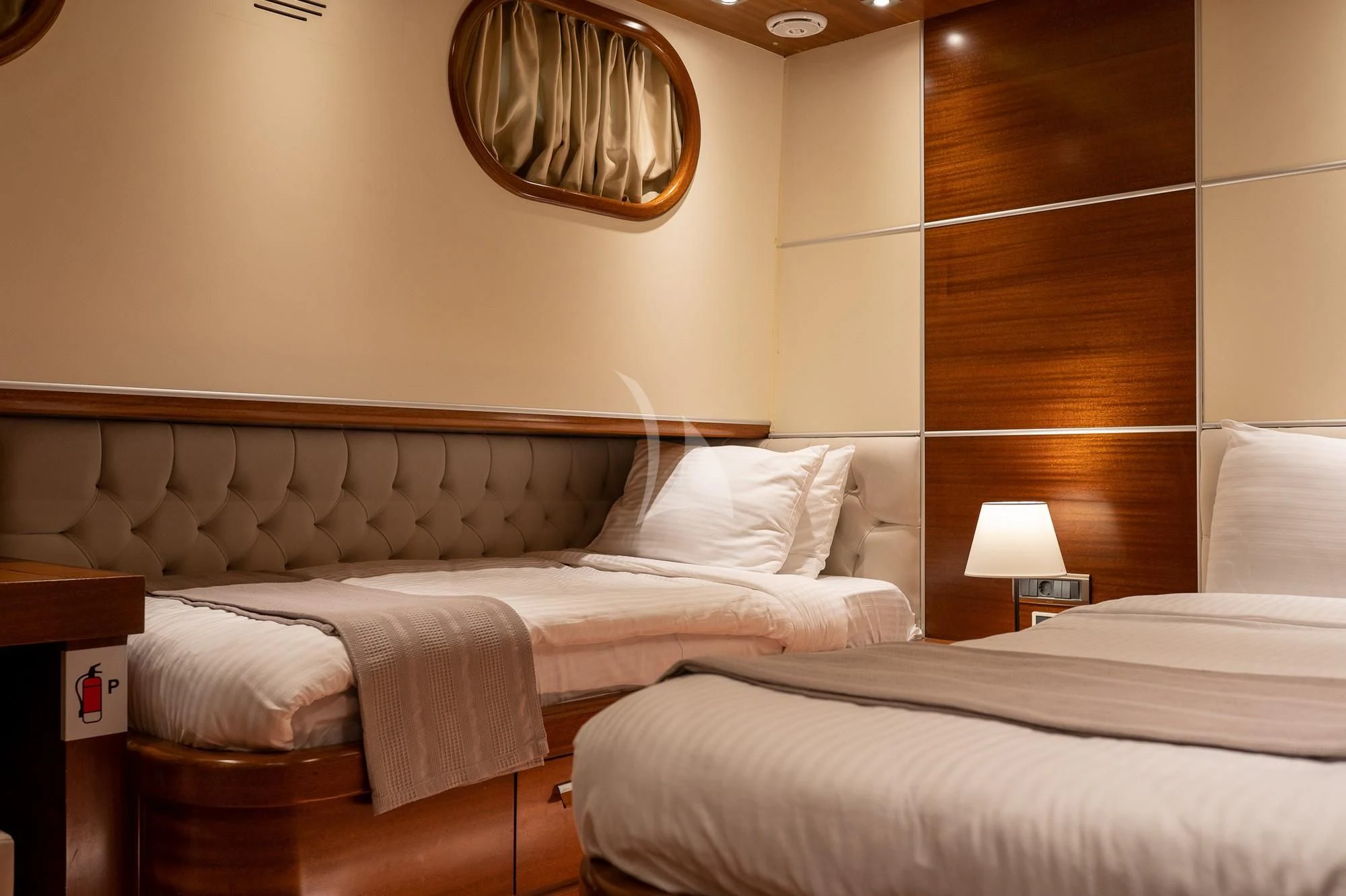 a couple of beds in a hotel room aboard LA BELLA VITA Yacht for Sale