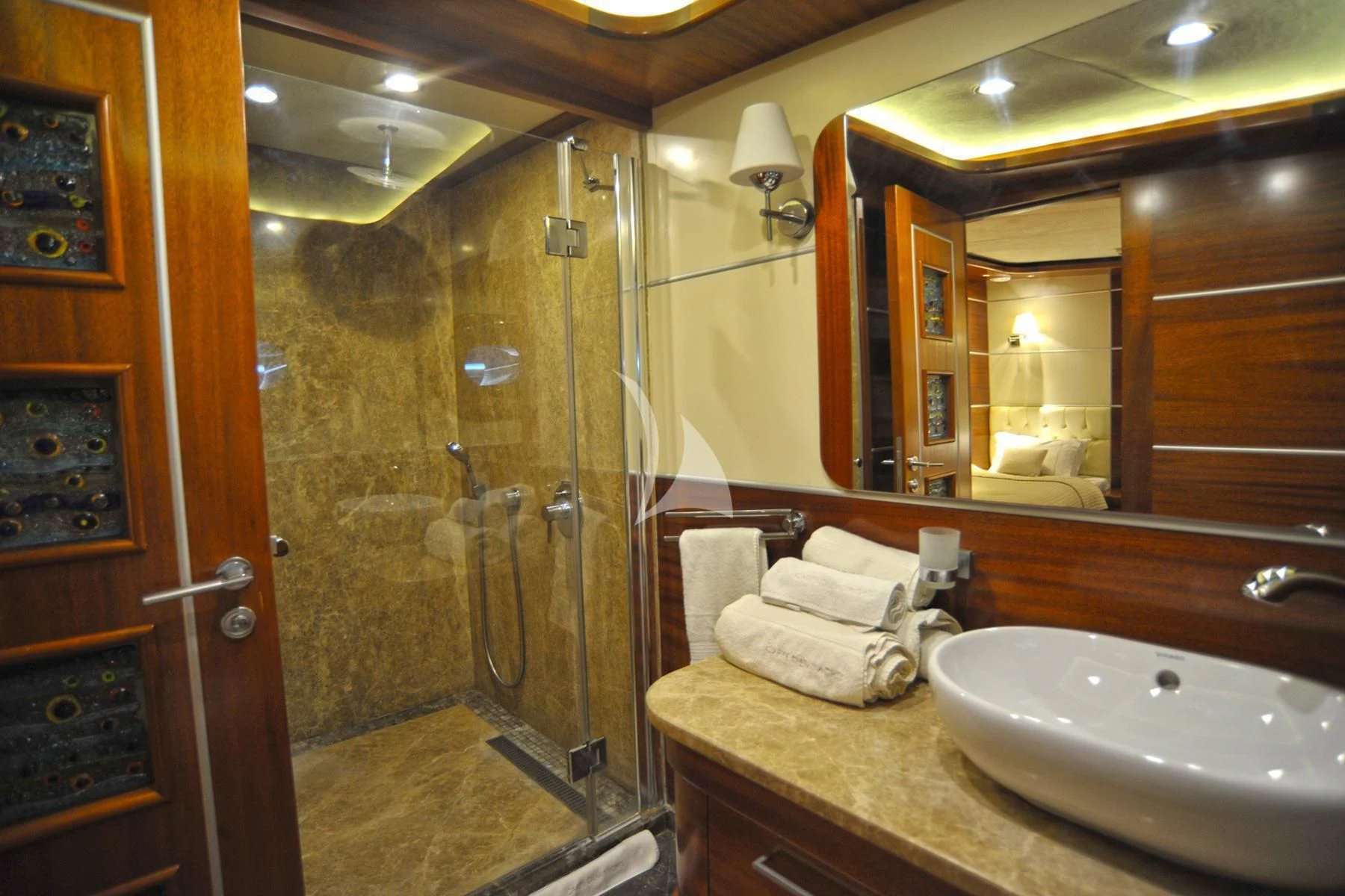a bathroom with a glass shower aboard LA BELLA VITA Yacht for Sale