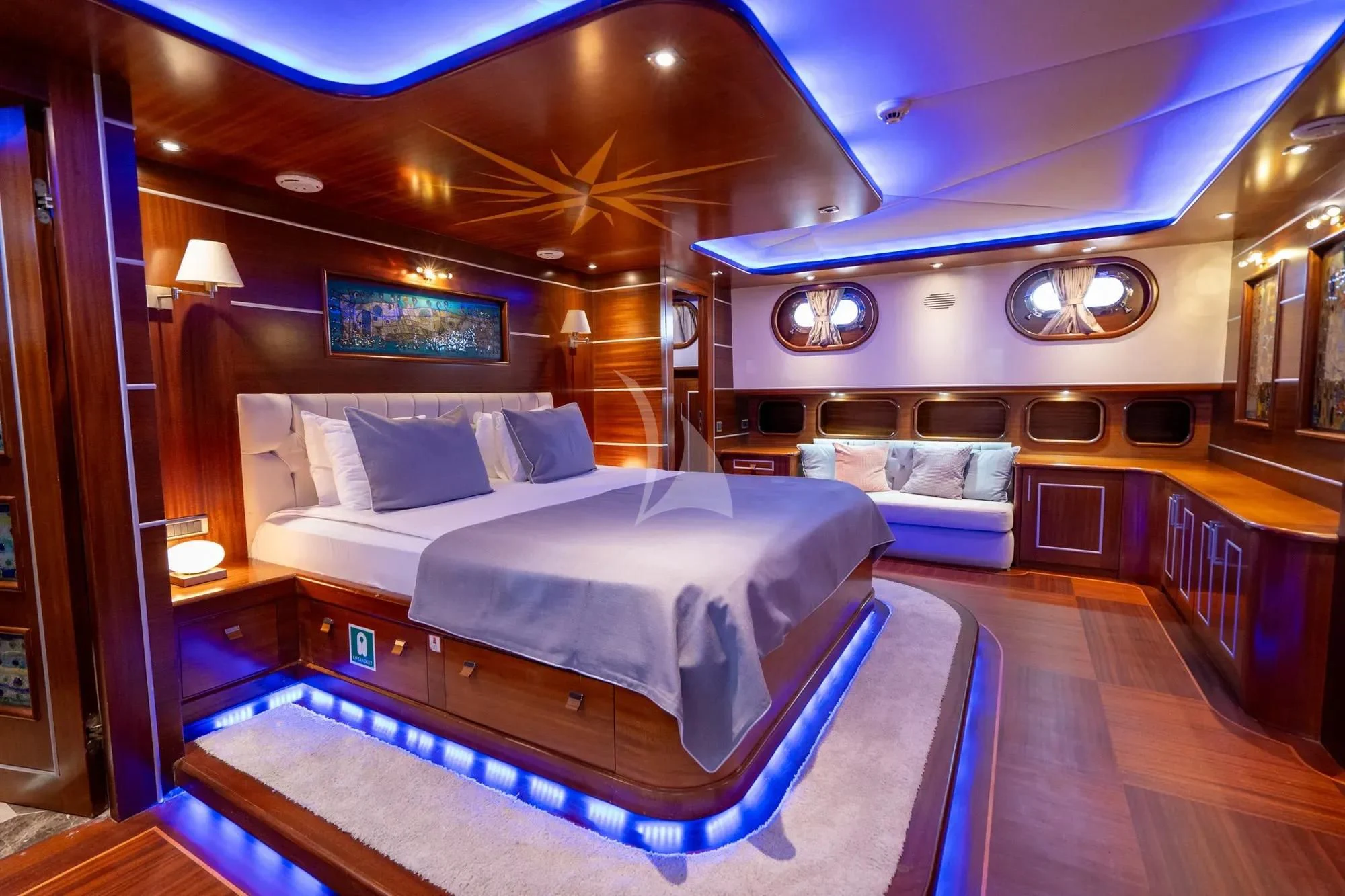a room with a bed and a couch aboard LA BELLA VITA Yacht for Sale