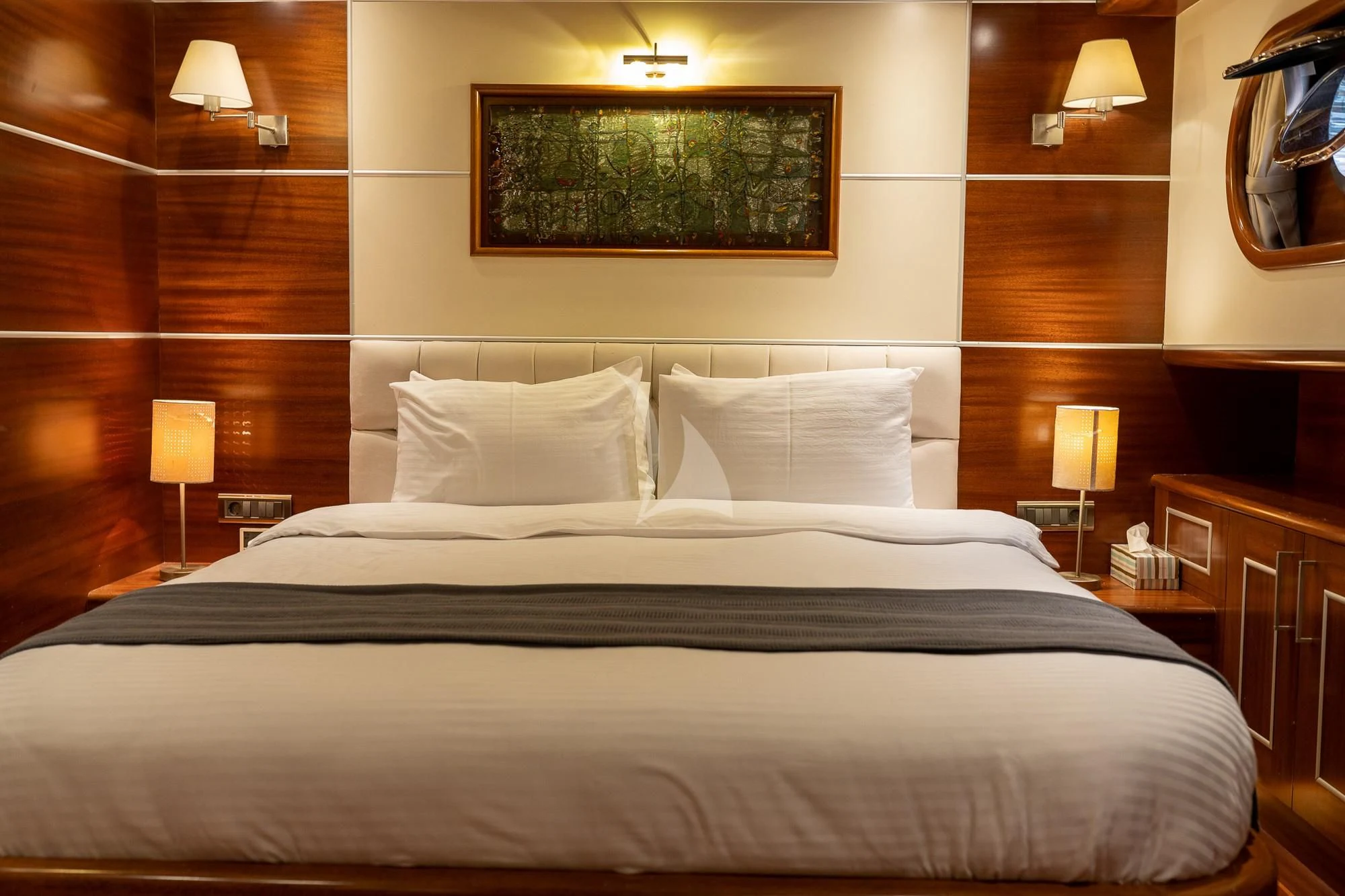 a bed with white pillows aboard LA BELLA VITA Yacht for Sale