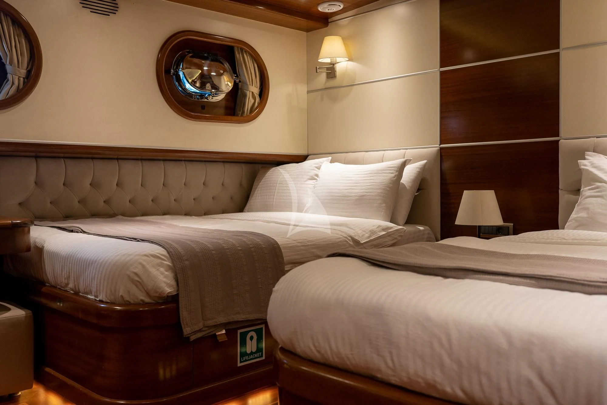 a hotel room with two beds aboard LA BELLA VITA Yacht for Sale
