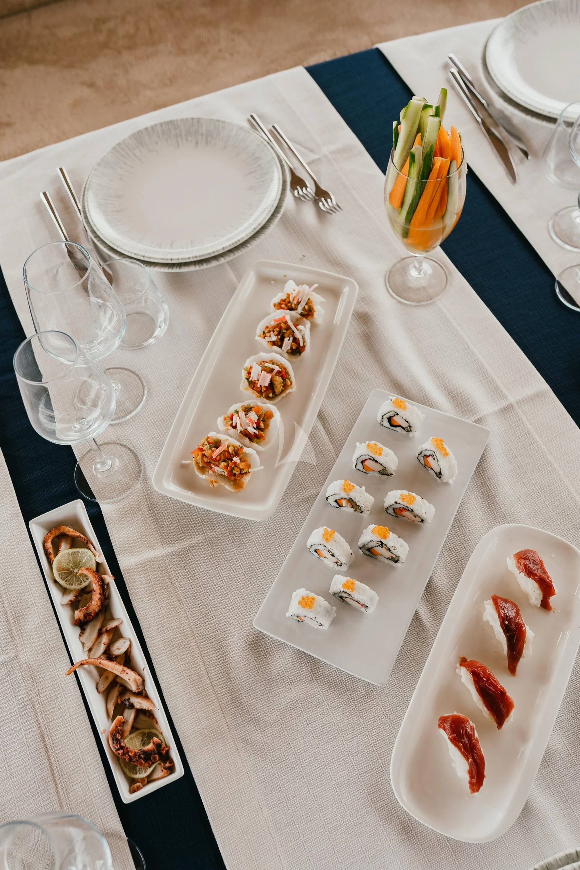 a table with plates and glasses aboard LA BELLA VITA Yacht for Sale