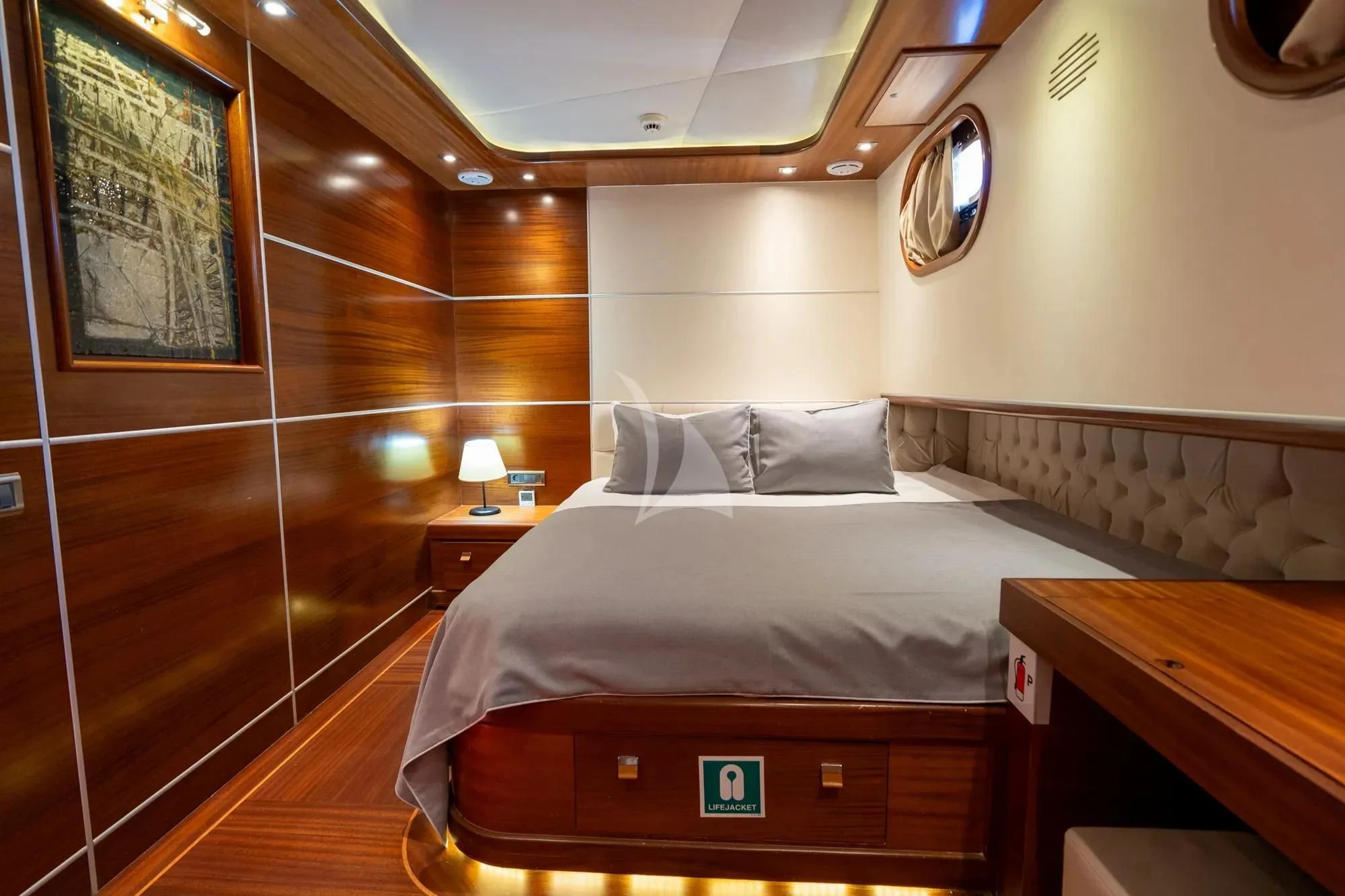a bed in a room aboard LA BELLA VITA Yacht for Sale