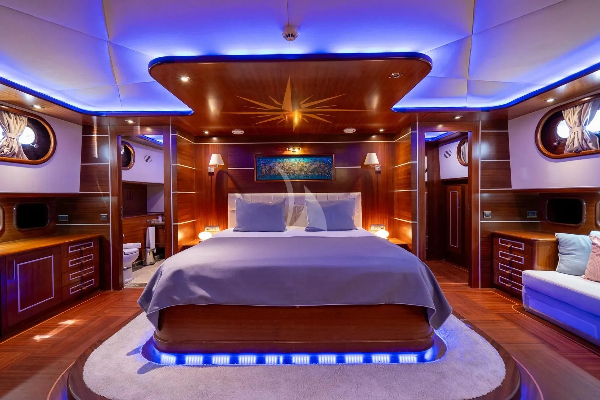 a large bed in a room aboard LA BELLA VITA Yacht for Sale