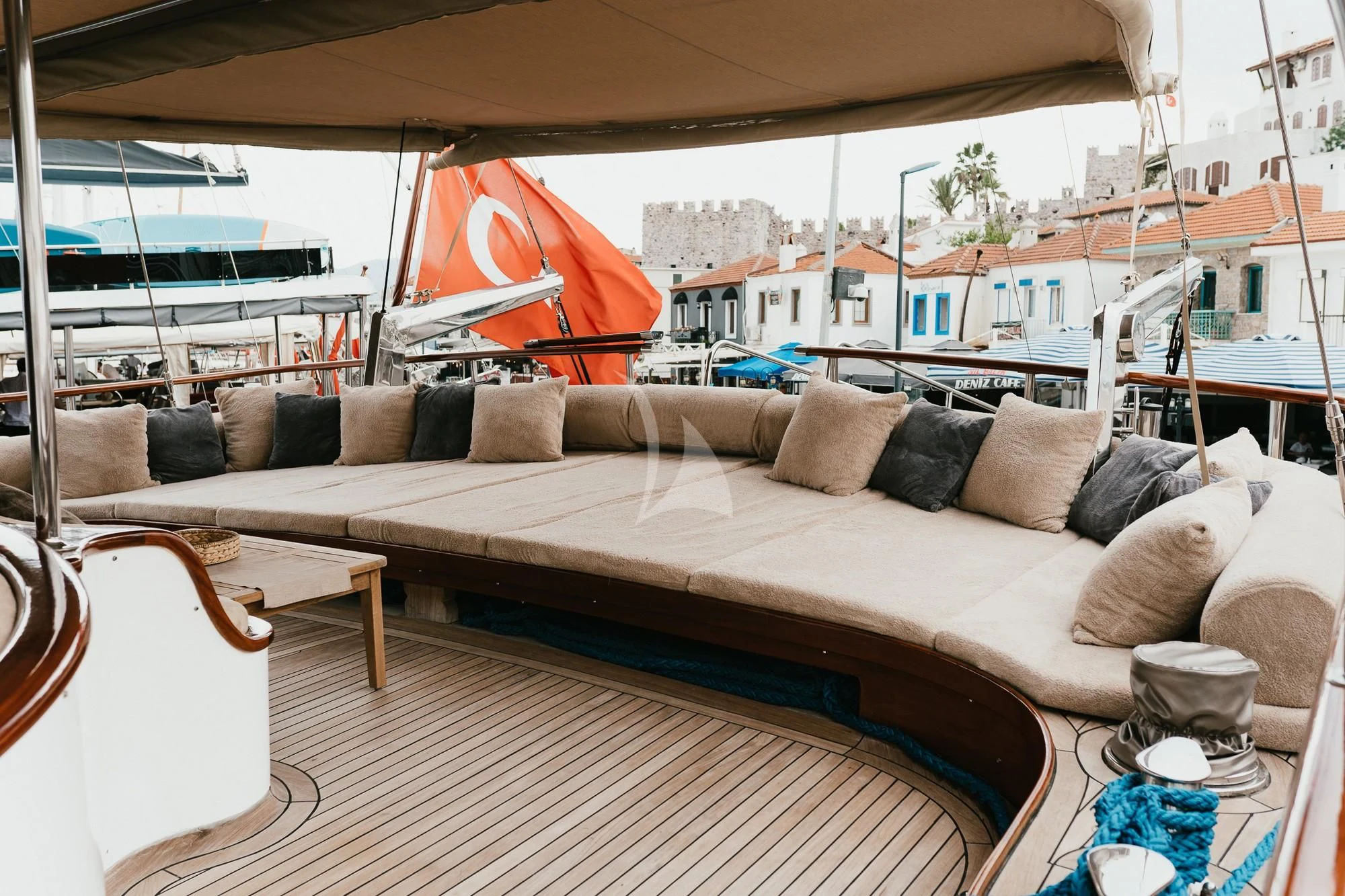 a couch with pillows on it aboard LA BELLA VITA Yacht for Sale