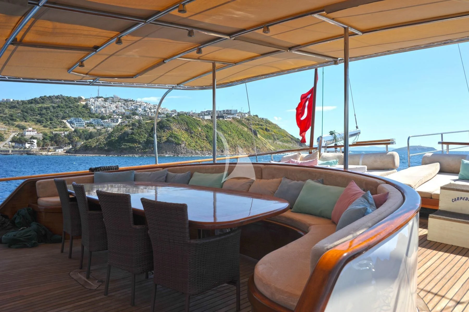 a deck with chairs and tables aboard LA BELLA VITA Yacht for Sale