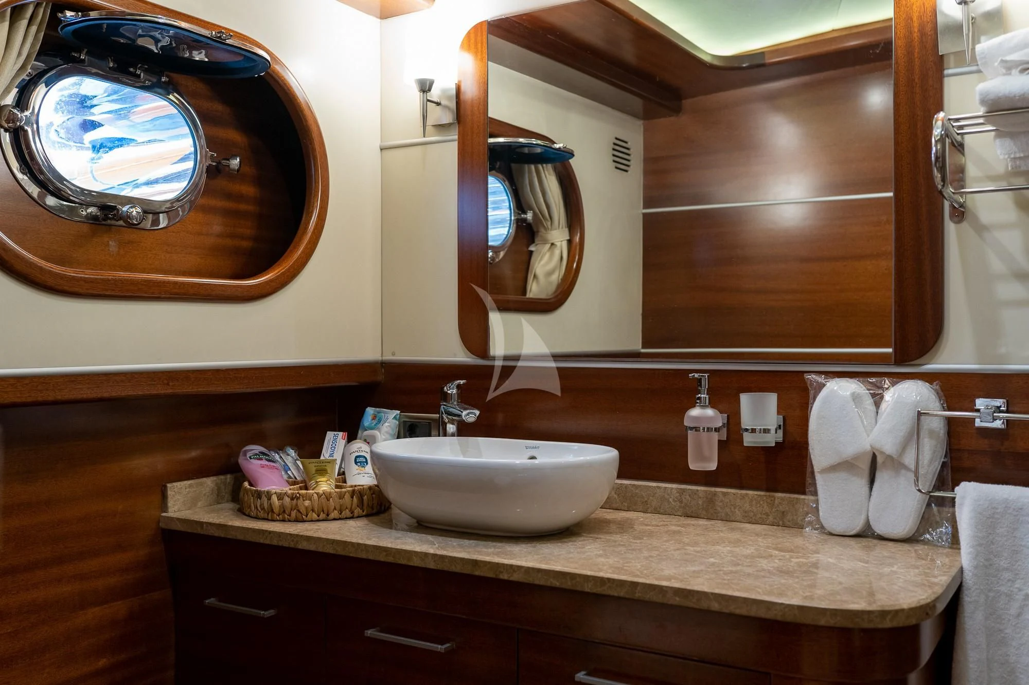 a bathroom with a large mirror aboard LA BELLA VITA Yacht for Sale
