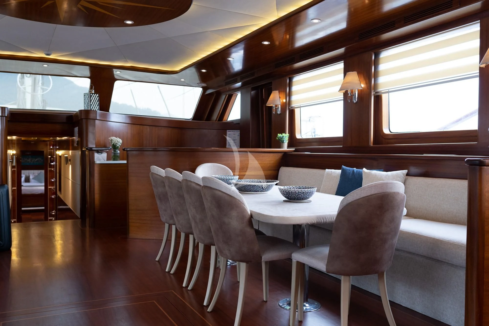 a large kitchen with a dining table aboard LA BELLA VITA Yacht for Sale
