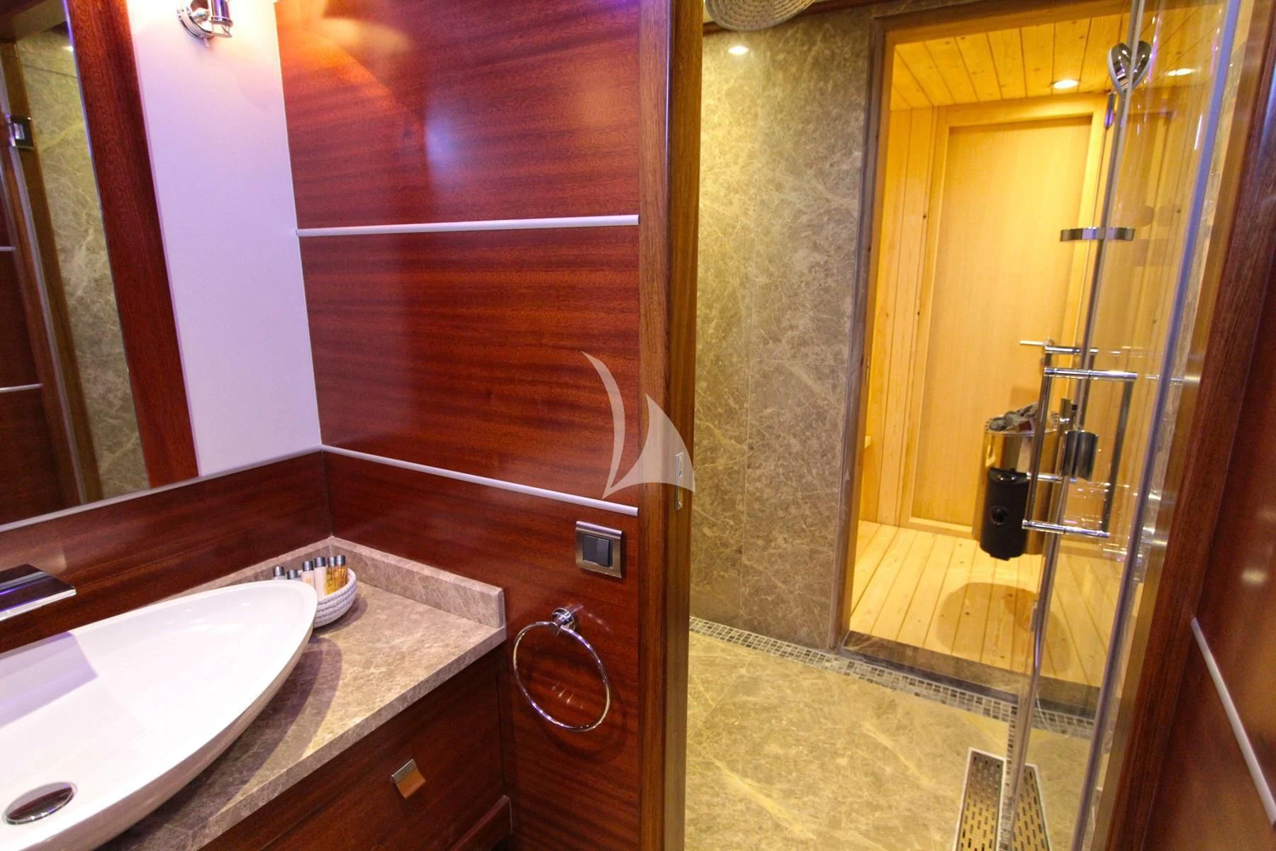 a bathroom with a sink and a shower aboard LA BELLA VITA Yacht for Sale