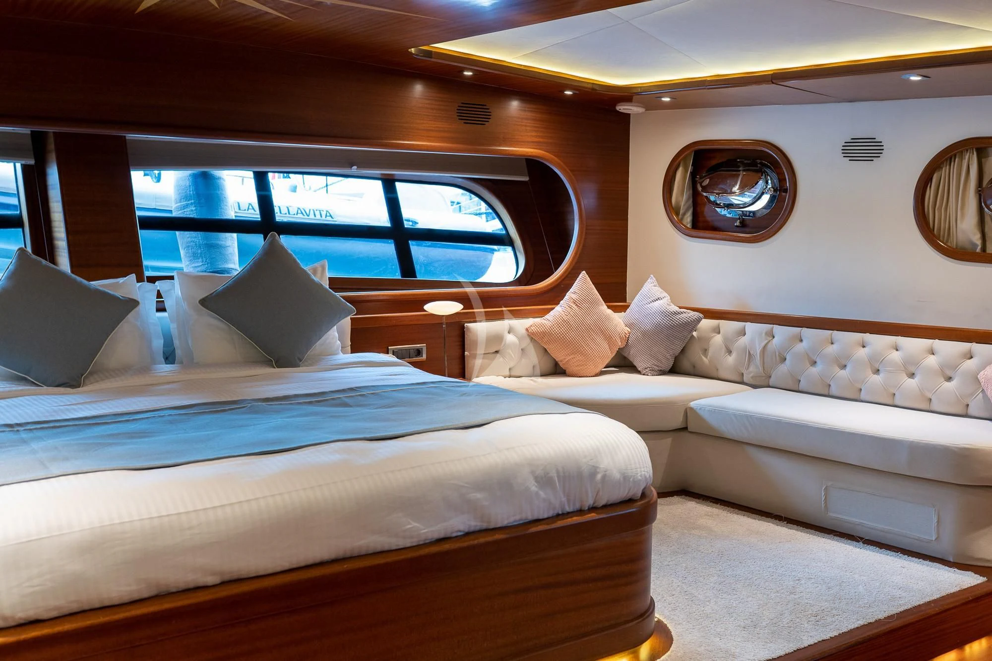 a room with a bed and a window aboard LA BELLA VITA Yacht for Sale