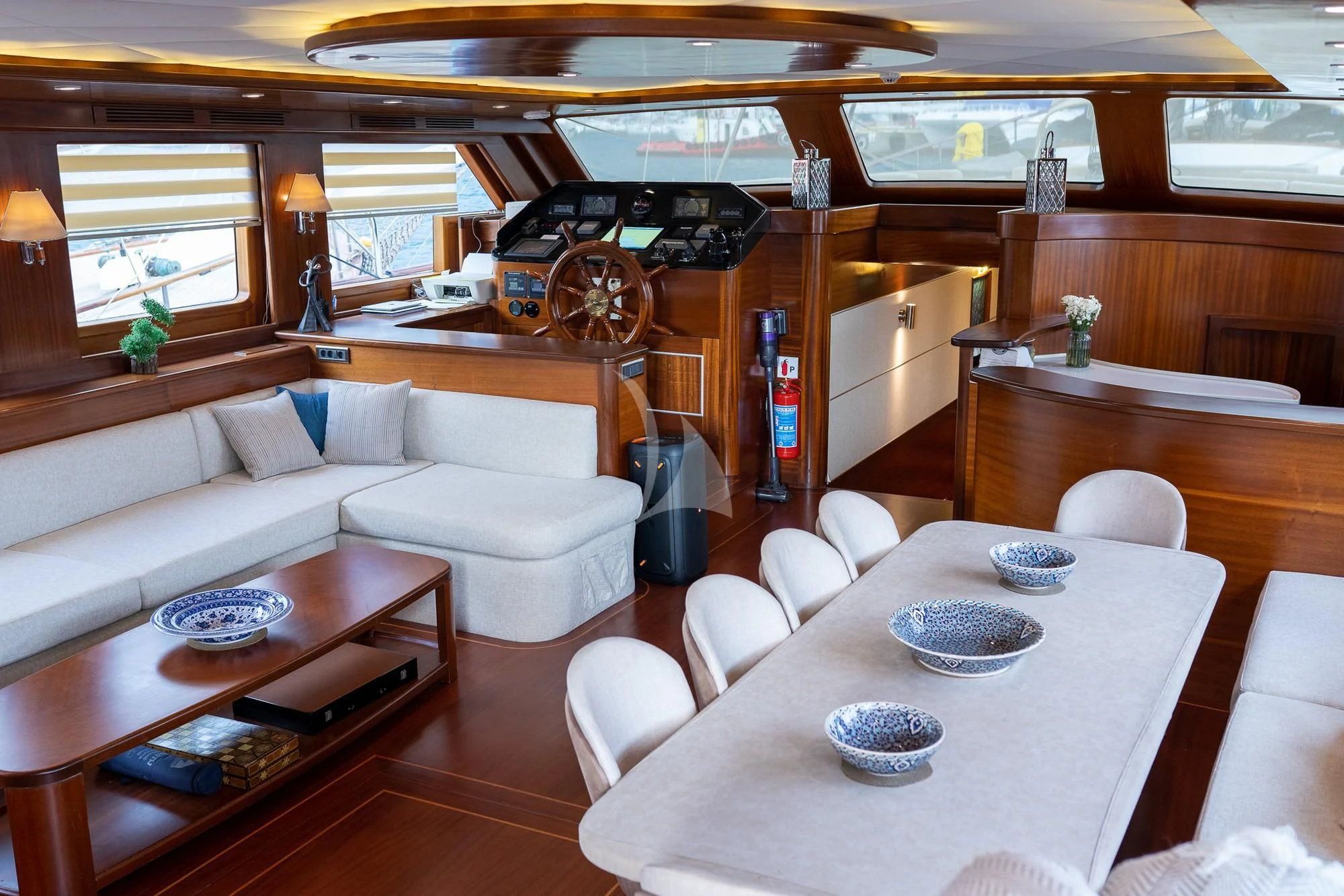 a living room with a car and a table aboard LA BELLA VITA Yacht for Sale