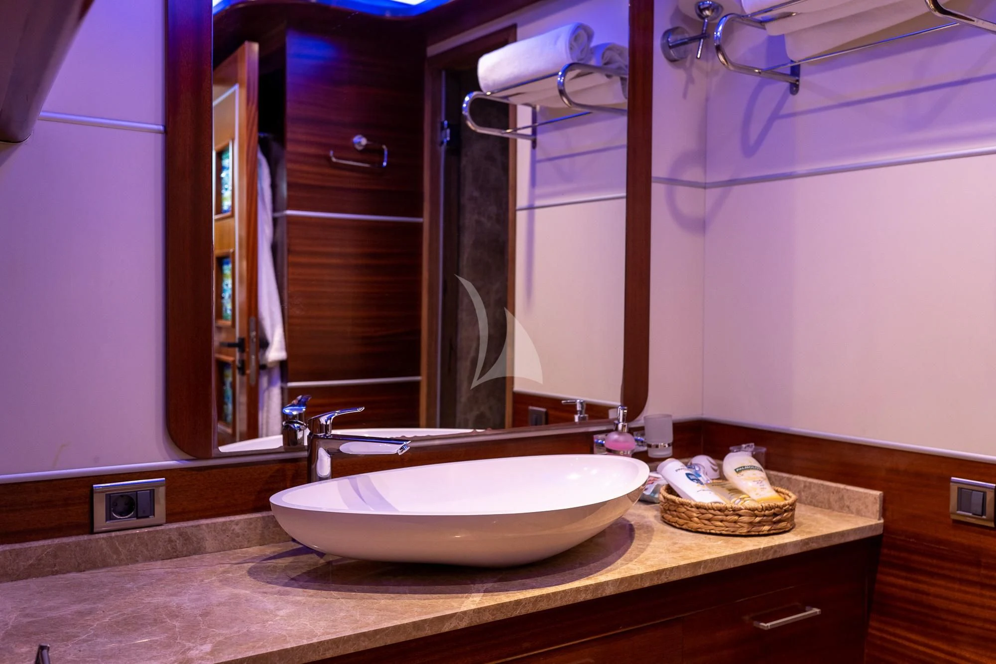 a bathroom with a sink and a mirror aboard LA BELLA VITA Yacht for Sale