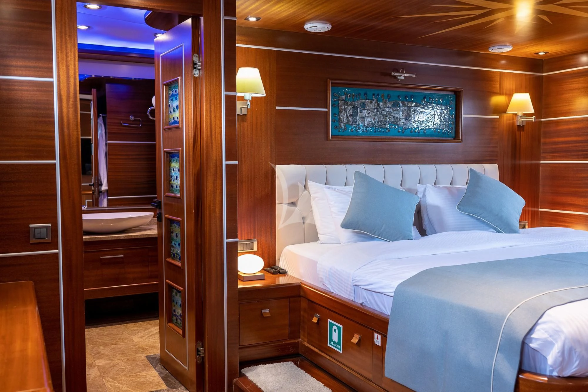 a bed in a room aboard LA BELLA VITA Yacht for Sale