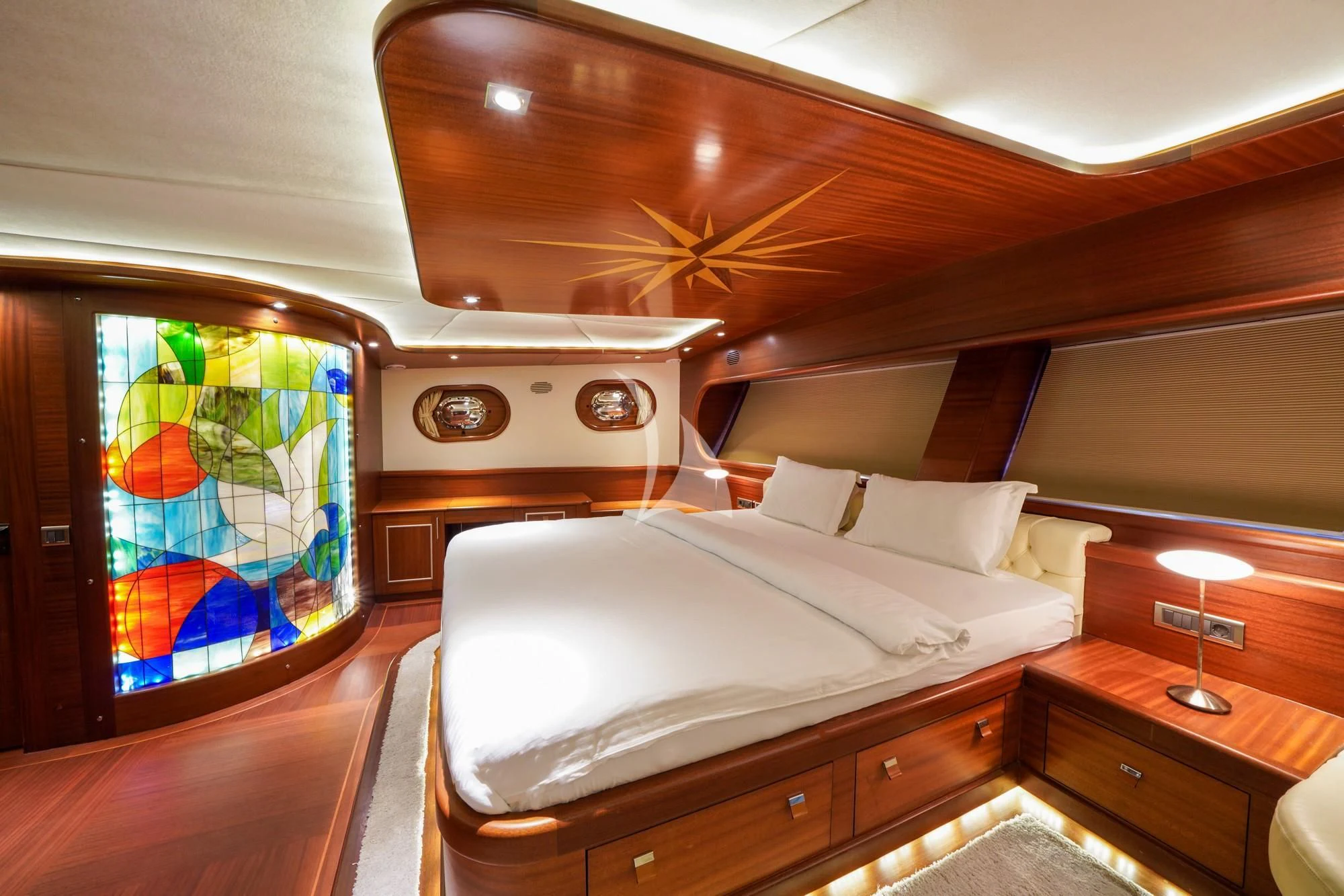 a room with a bed and a window aboard LA BELLA VITA Yacht for Sale