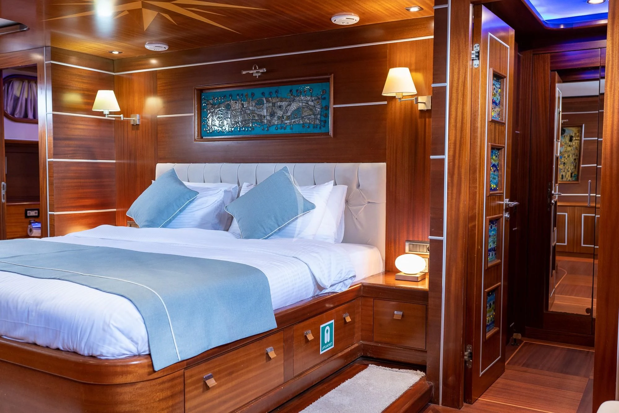 a bed in a room aboard LA BELLA VITA Yacht for Sale