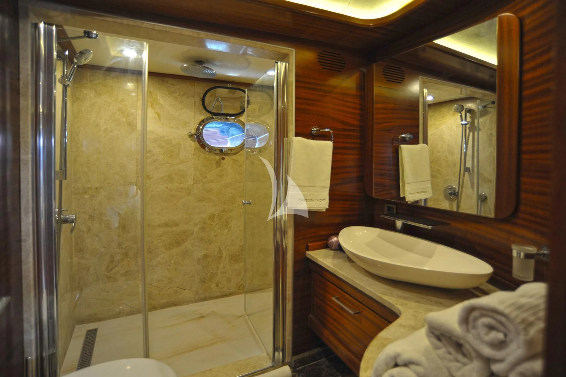 a bathroom with a glass shower aboard LA BELLA VITA Yacht for Sale