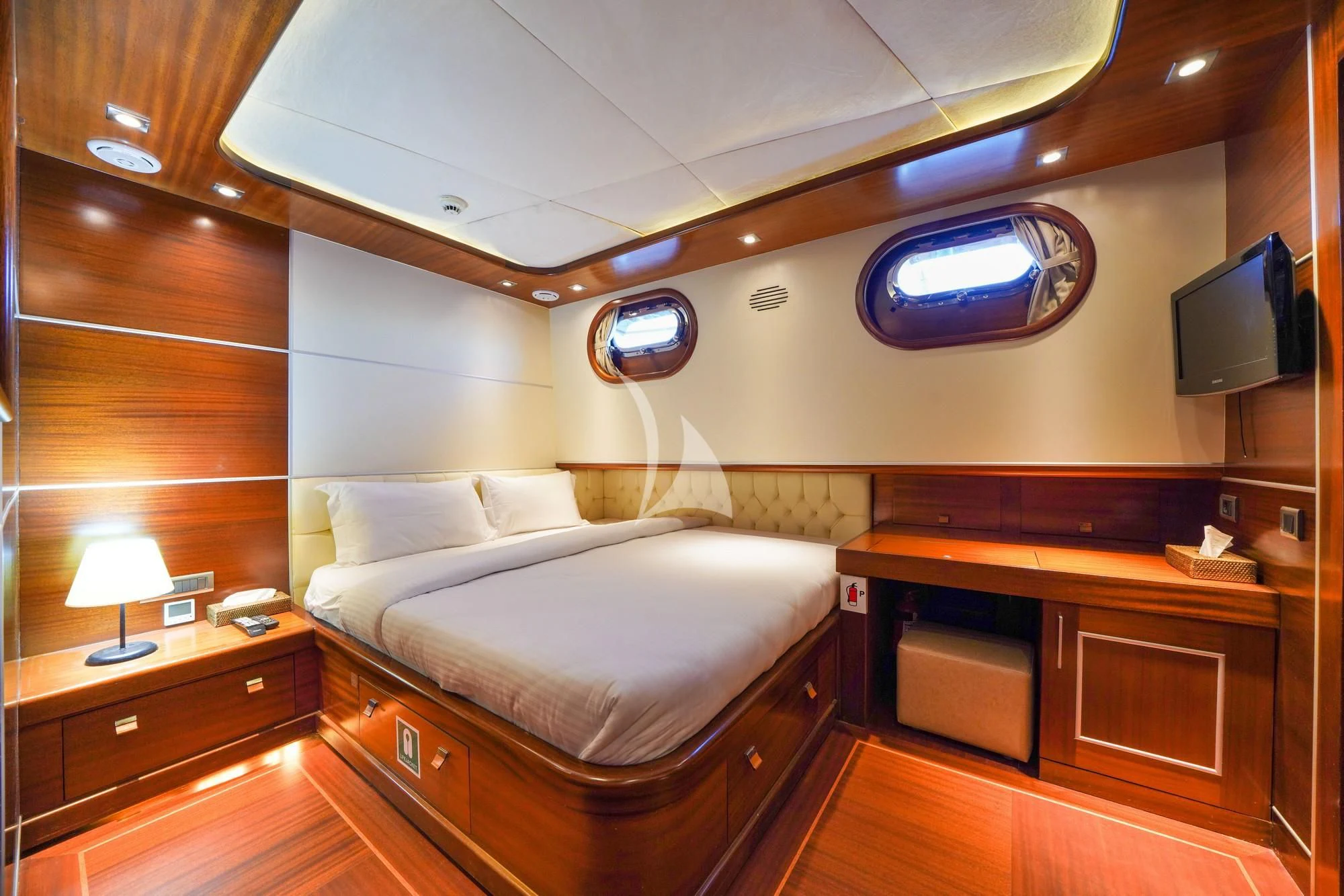 a room with a bed and a tv aboard LA BELLA VITA Yacht for Sale