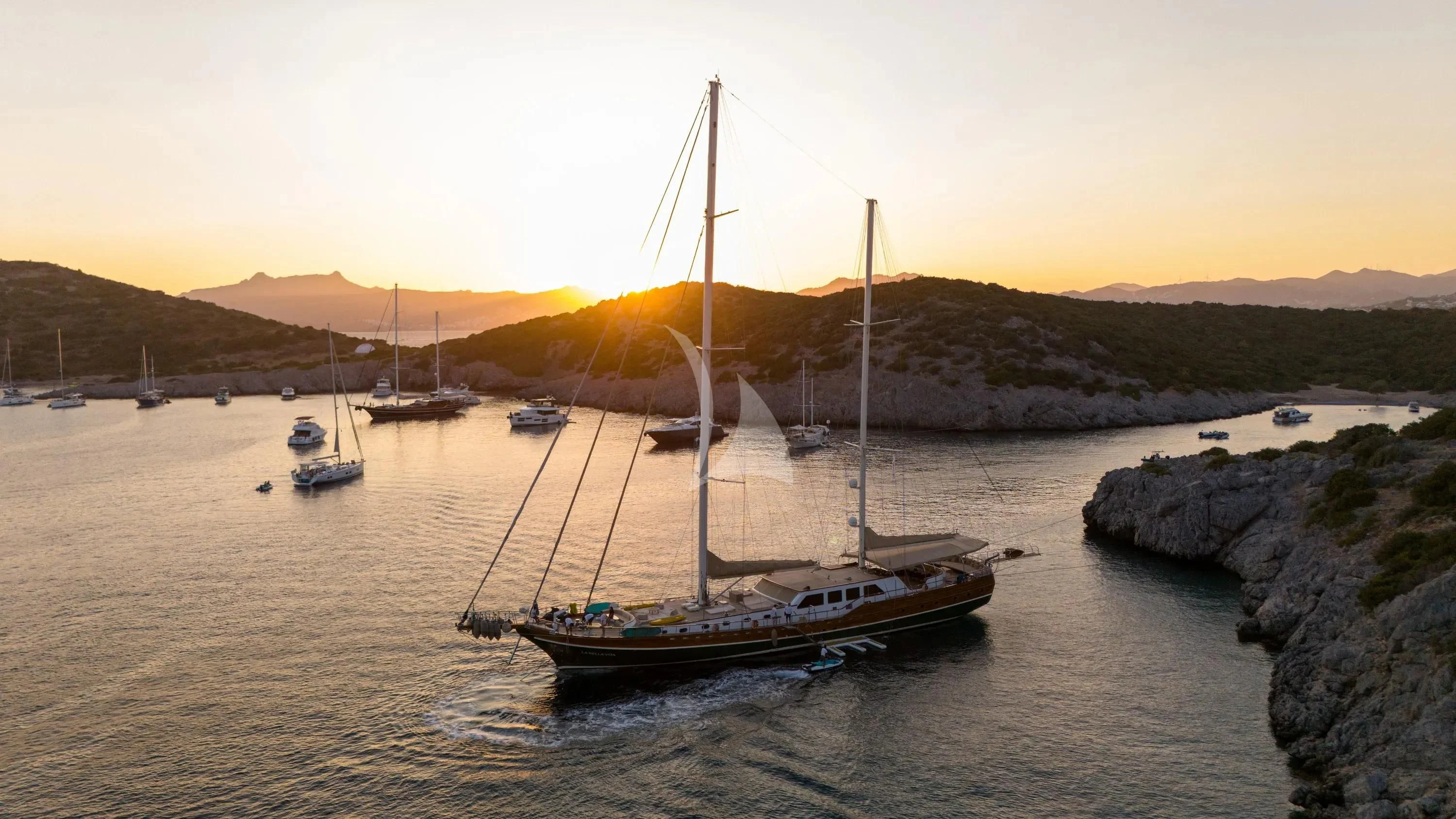 a group of boats in a bay aboard LA BELLA VITA Yacht for Sale