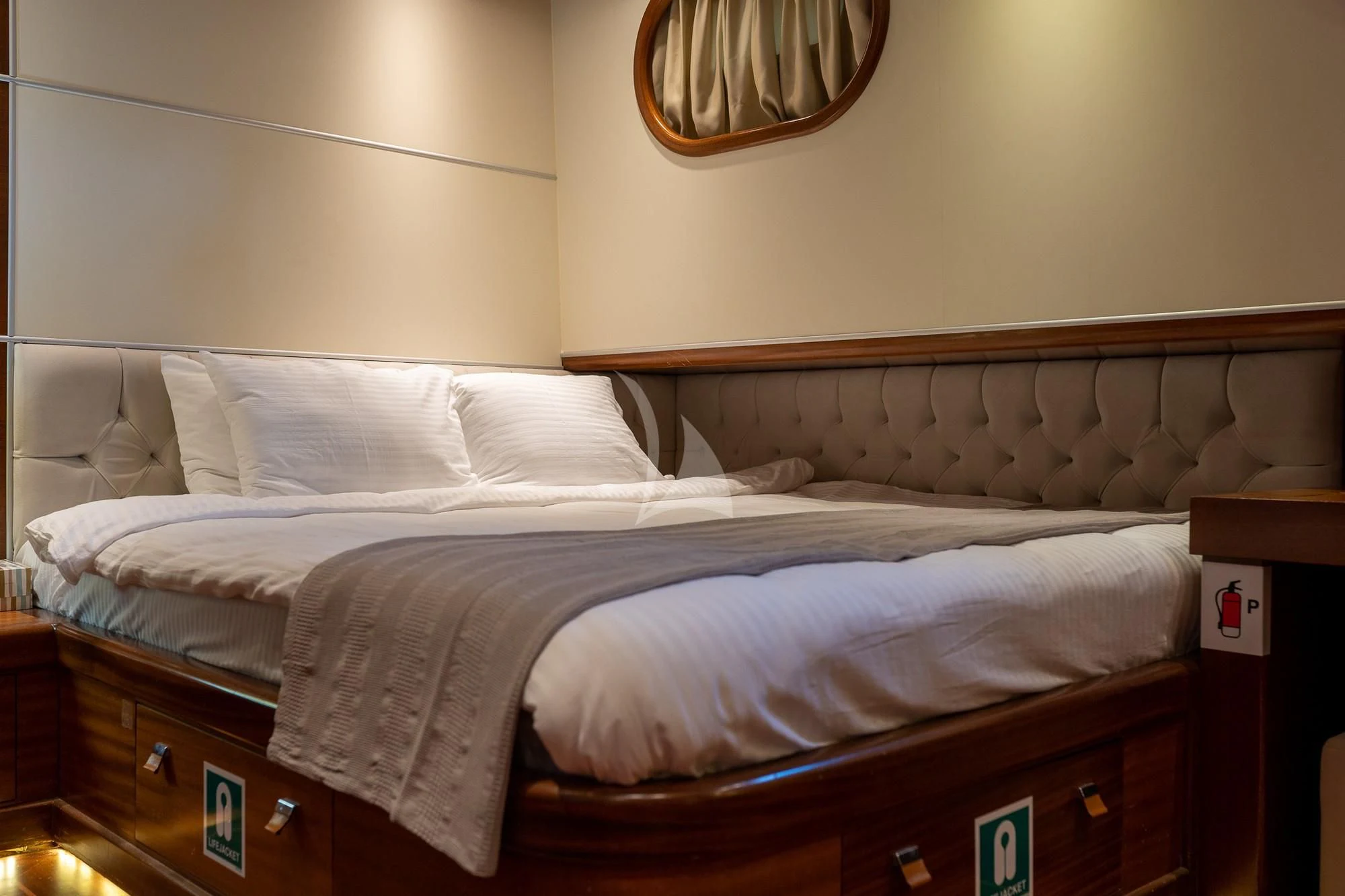 a bed with white sheets aboard LA BELLA VITA Yacht for Sale
