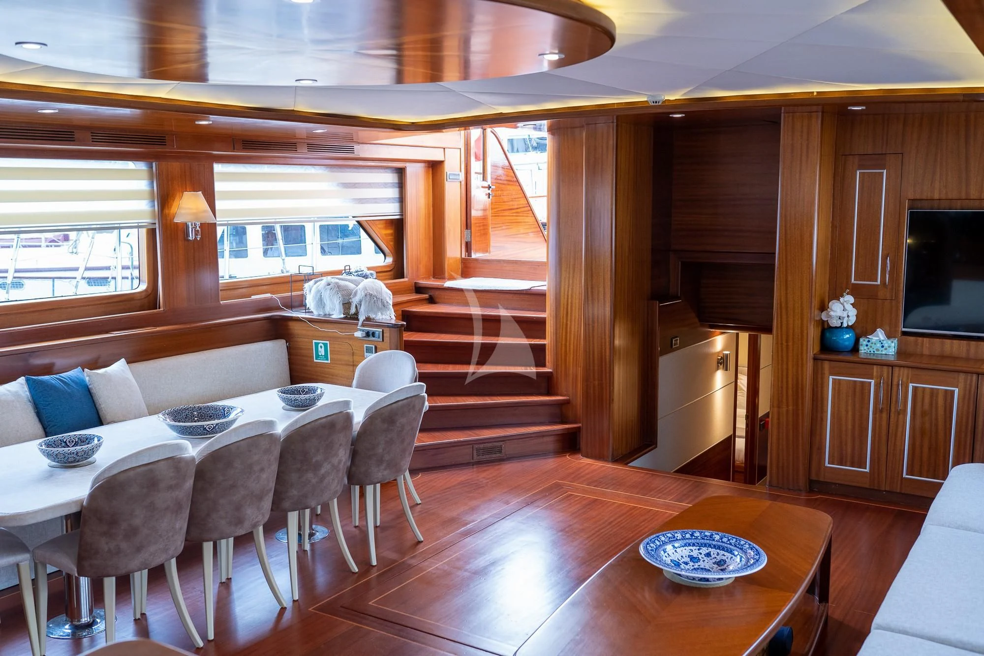 a living room with a staircase aboard LA BELLA VITA Yacht for Sale