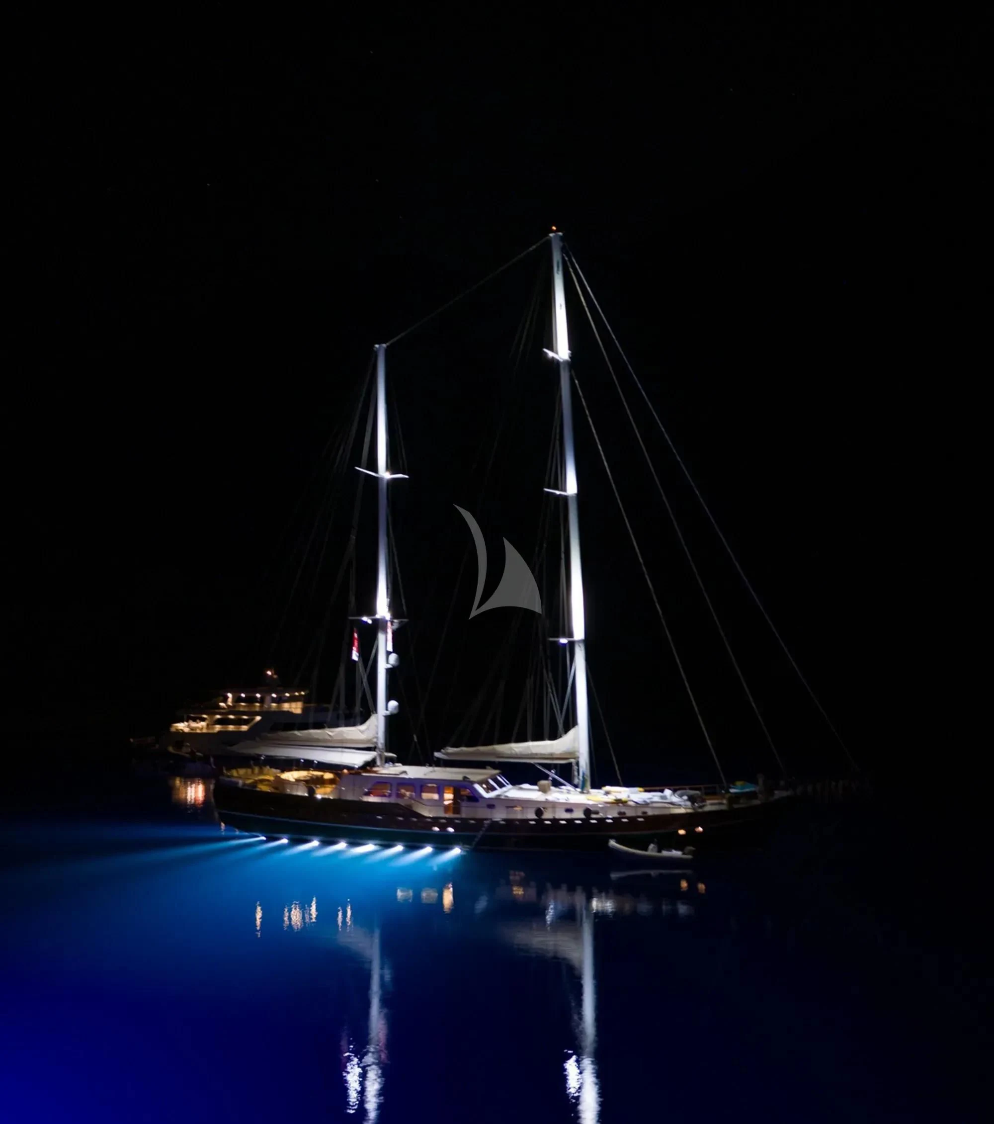 a sailboat at night aboard LA BELLA VITA Yacht for Sale