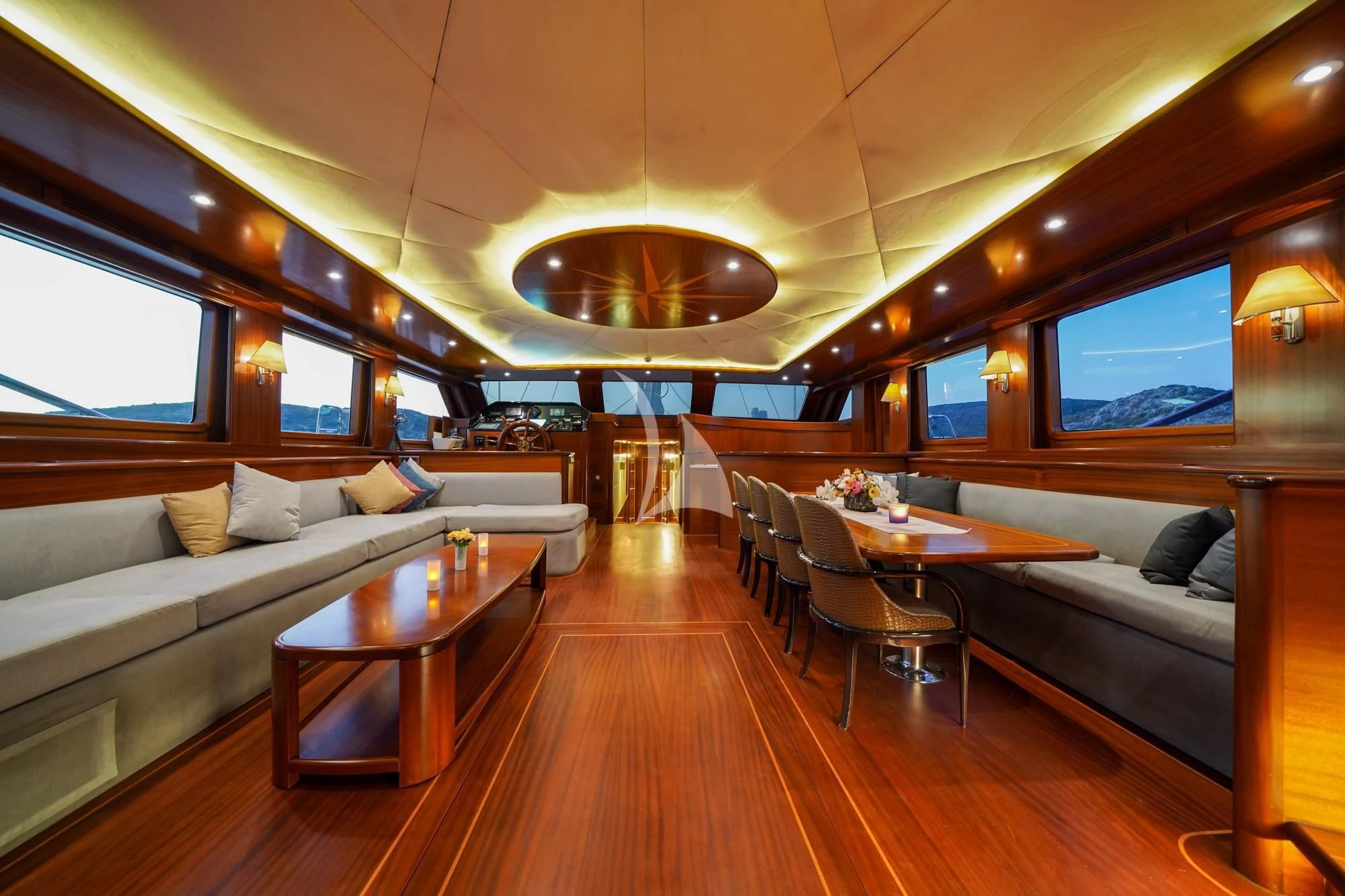 a living room with a couch and a table aboard LA BELLA VITA Yacht for Sale