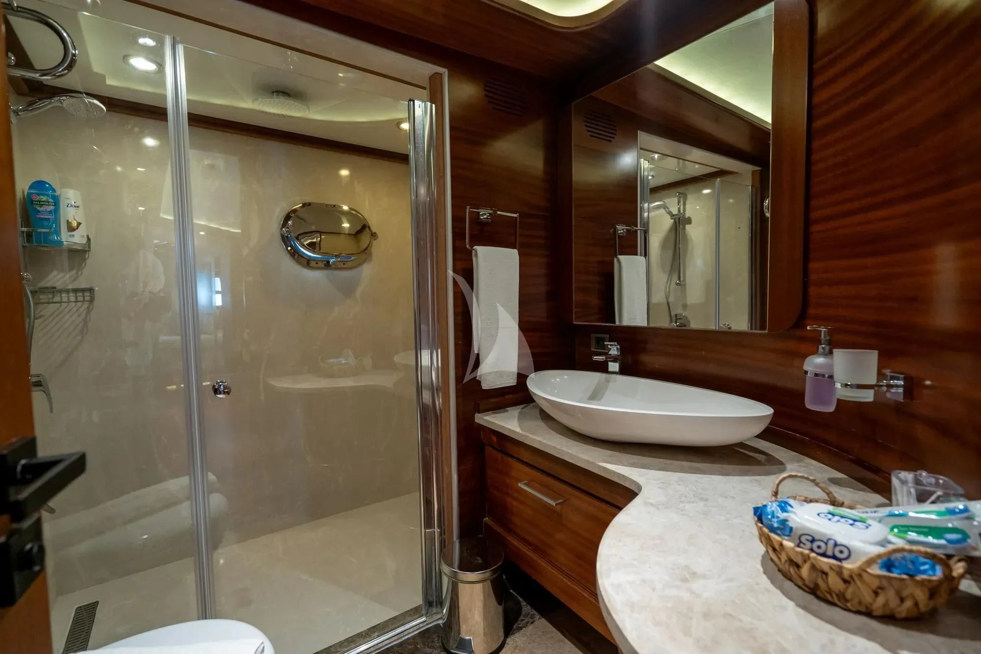 a bathroom with a glass shower aboard LA BELLA VITA Yacht for Sale
