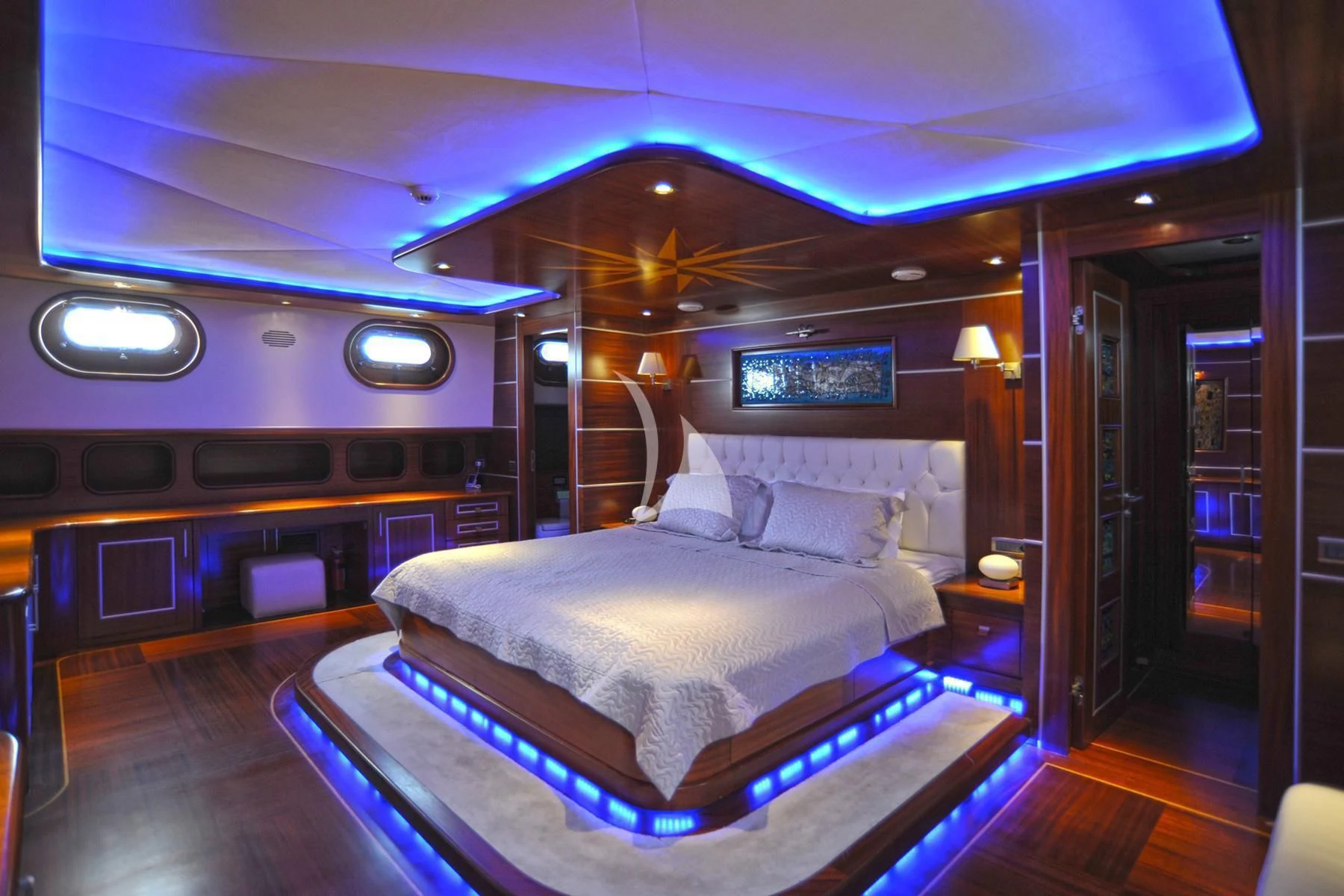 a large bed in a room aboard LA BELLA VITA Yacht for Sale