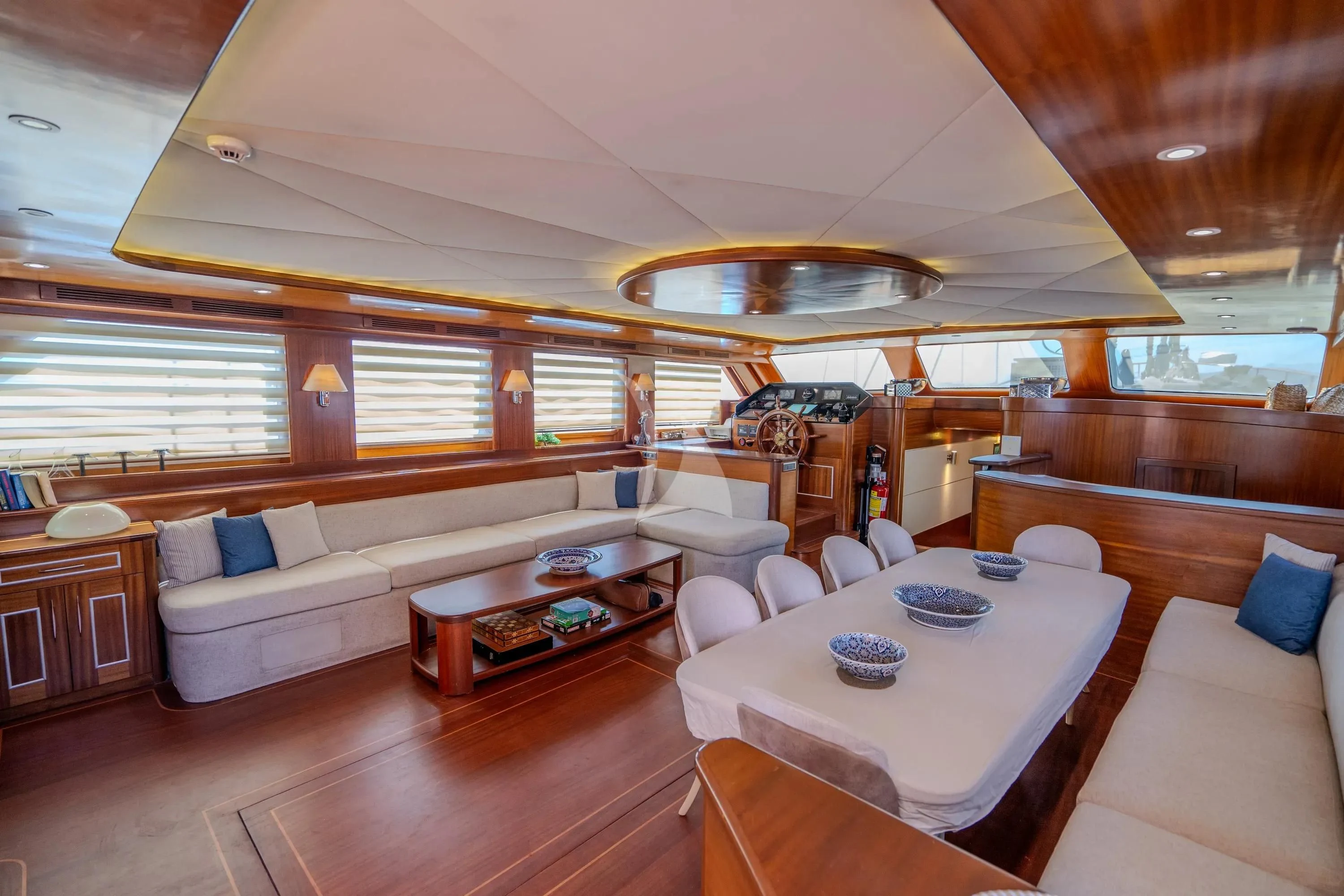 a room with a couch and a table aboard LA BELLA VITA Yacht for Sale